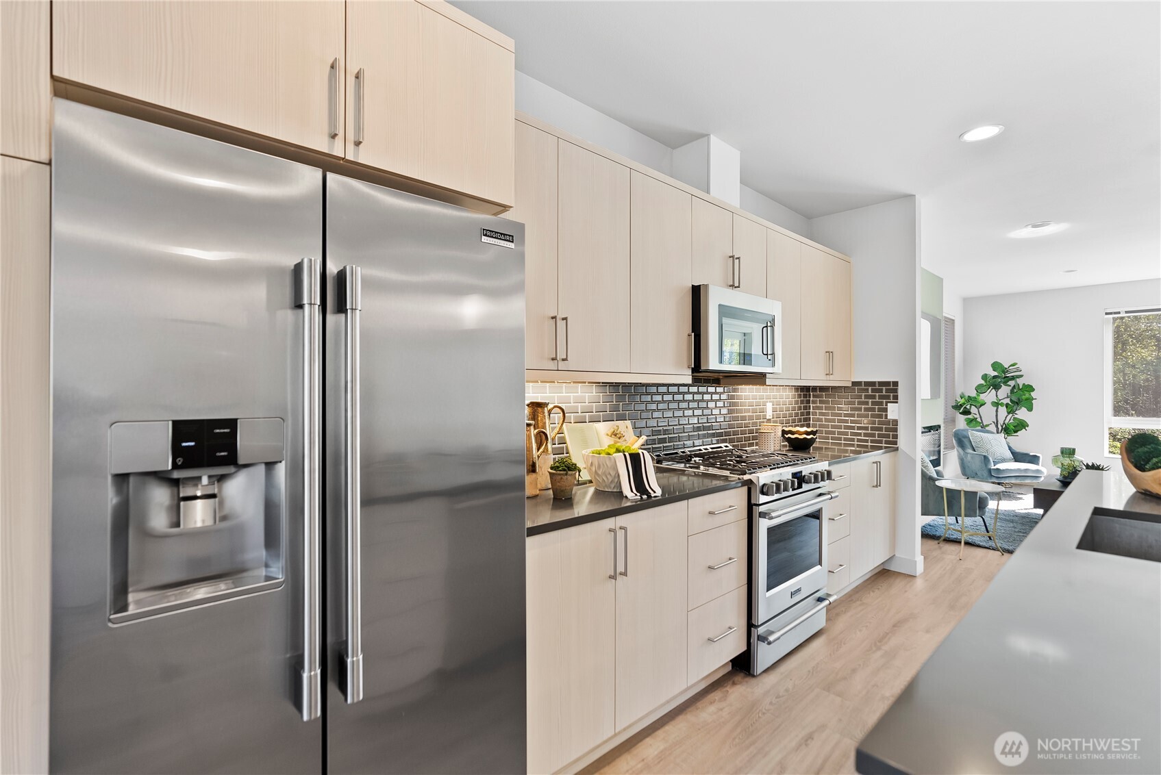 17905 35th Avenue Southeast, Unit A1 Bothell, WA 98012 - Photo 11 of 36 a kitchen with stainless steel appliances a refrigerator sink and stove