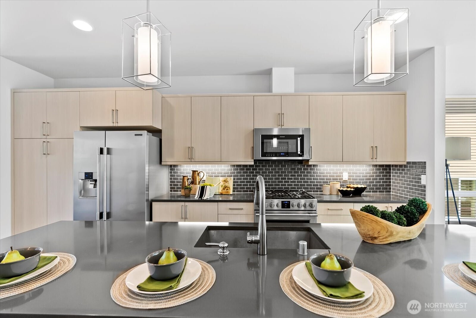 17905 35th Avenue Southeast, Unit A1 Bothell, WA 98012 - Photo 17 of 36 a kitchen with stainless steel appliances a dining table and chairs