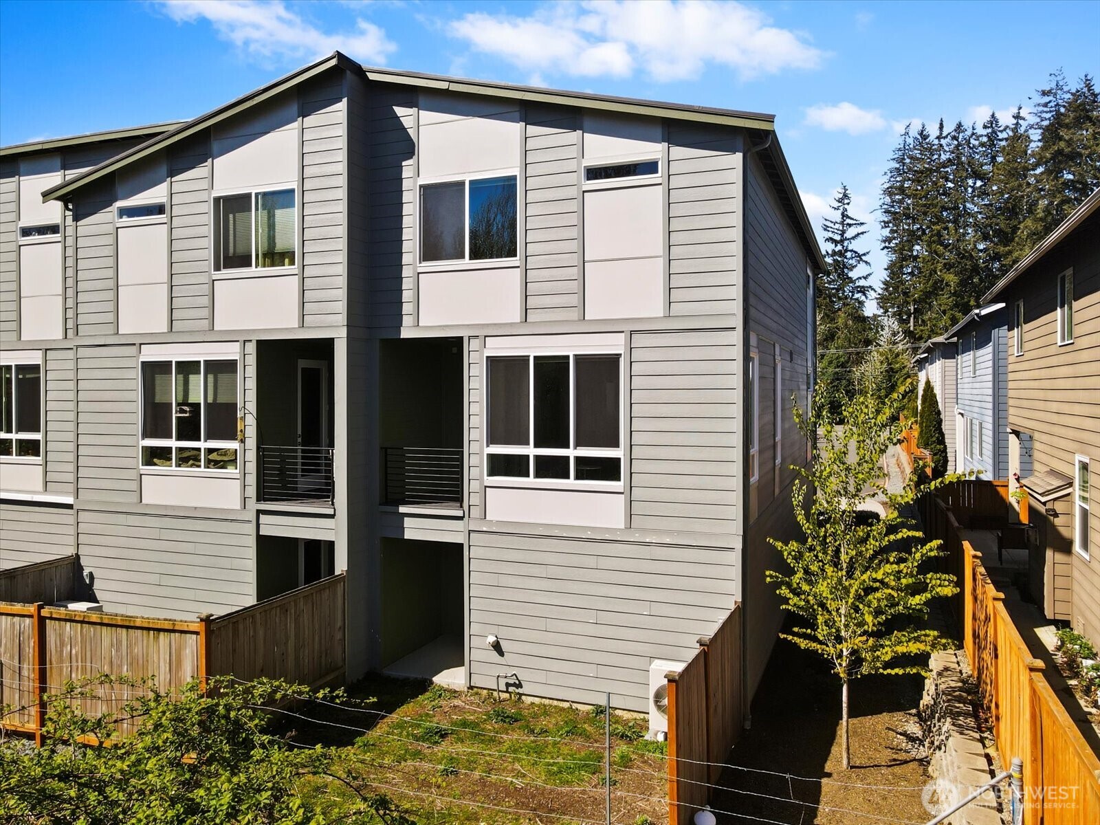 17905 35th Avenue Southeast, Unit A1 Bothell, WA 98012 - Photo 2 of 36 a view of a house with a yard