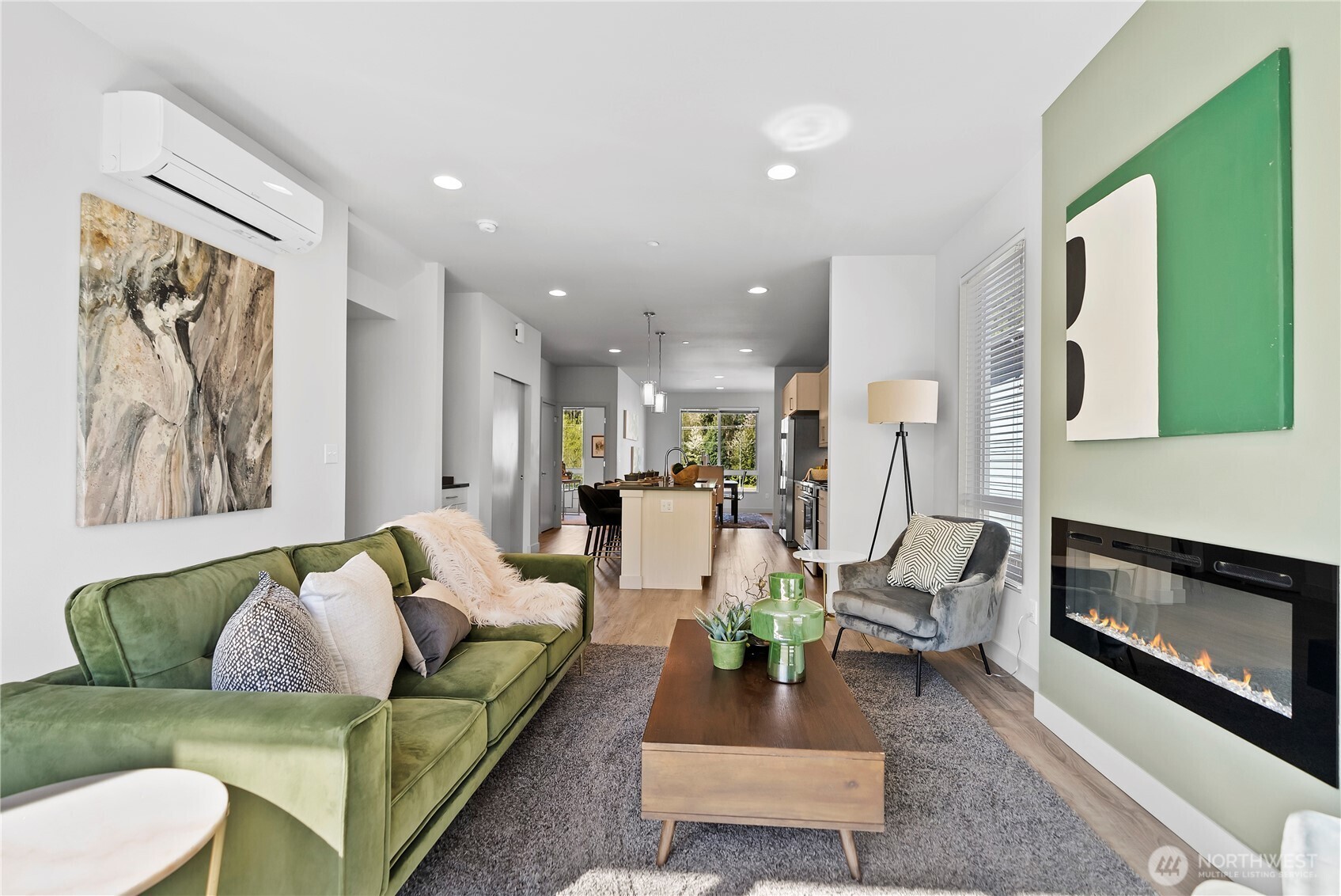 17905 35th Avenue Southeast, Unit A1 Bothell, WA 98012 - Photo 23 of 36 a living room with furniture and a fireplace