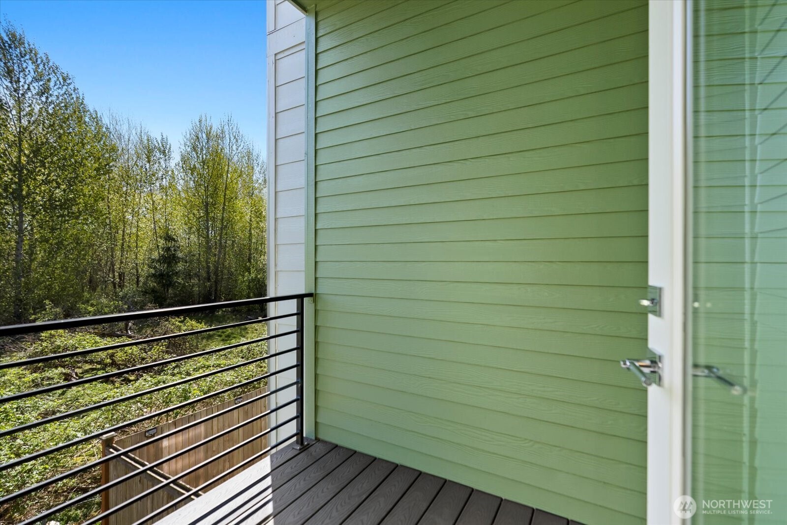 17905 35th Avenue Southeast, Unit A1 Bothell, WA 98012 - Photo 5 of 36 a view of a balcony with wooden floor