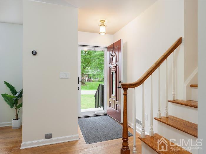 459 Milcrip Road Bridgewater, NJ 08807 - Photo 4 of 28 a view of entryway with wooden floor and stairs