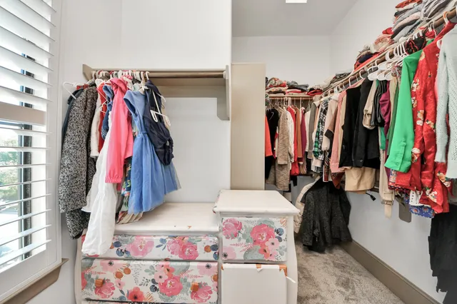 a utility room with cabinets washer and dryer