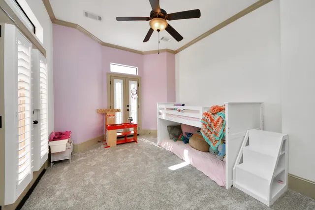 a view of a patio with a dining table and chairs