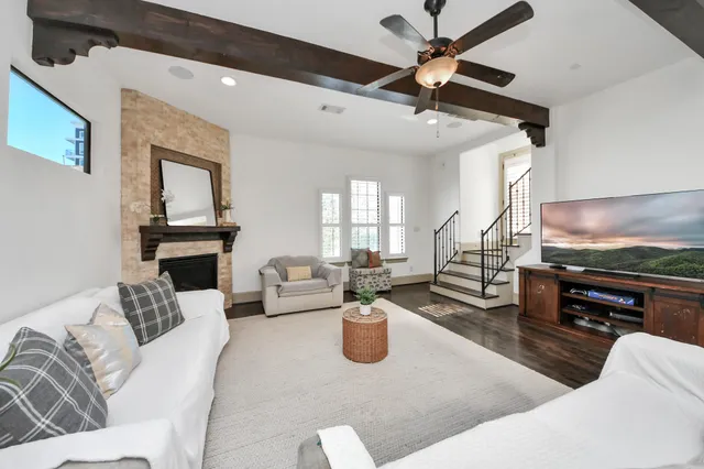 a kitchen with a stove a refrigerator and cabinets