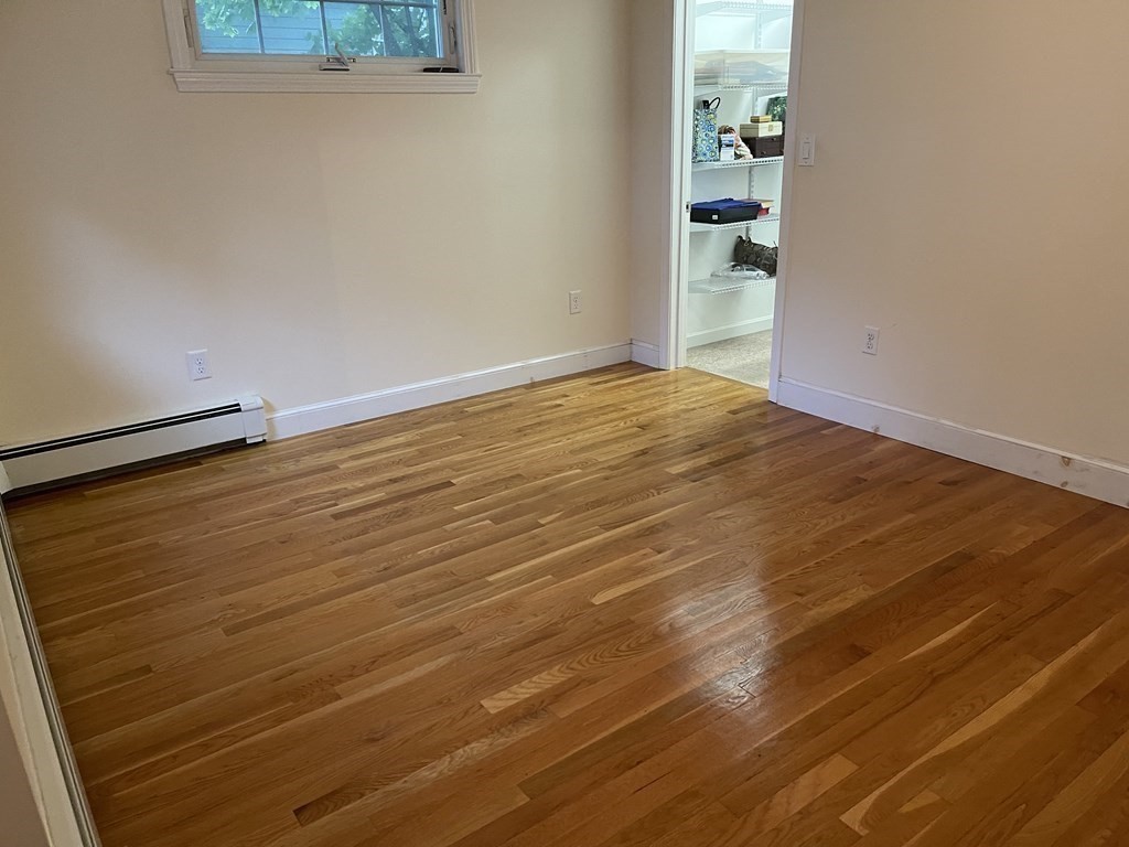 223 Governors Road Quincy, MA 02169 - Photo 17 of 40 a view of empty room with wooden floor