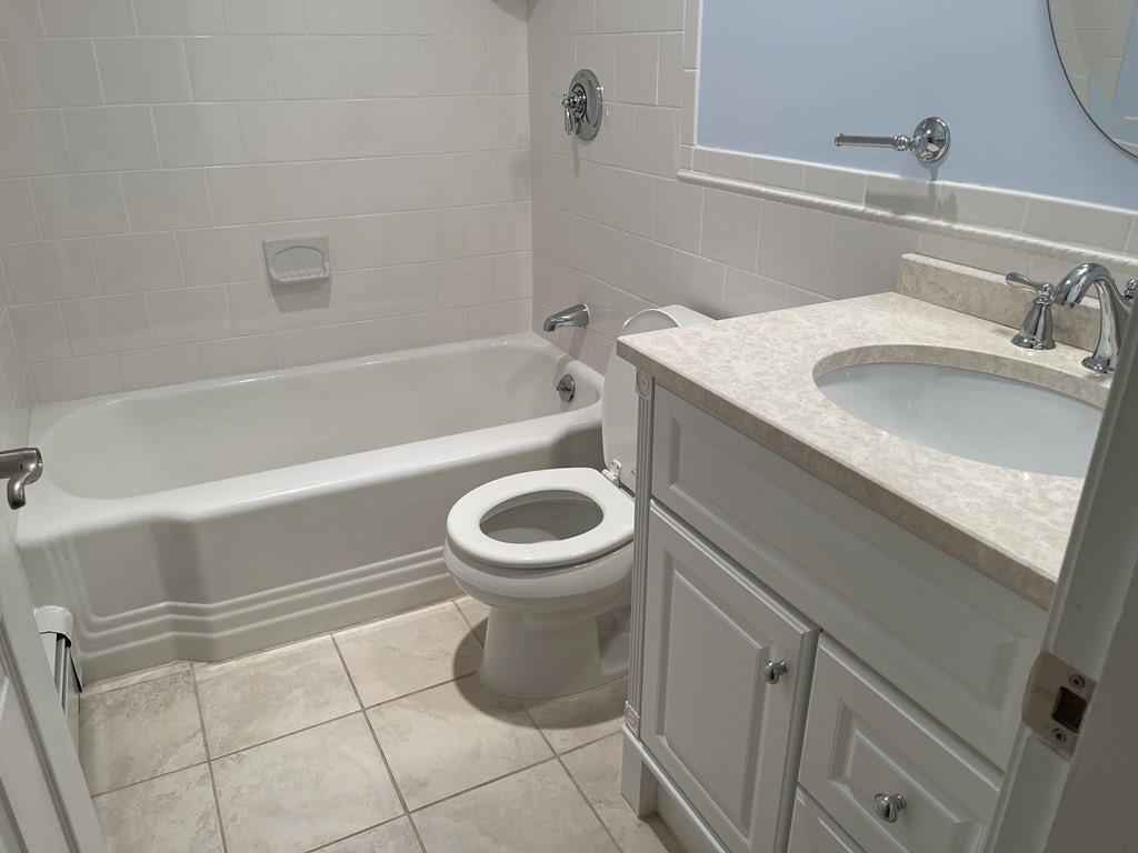 223 Governors Road Quincy, MA 02169 - Photo 26 of 40 a bathroom with a sink a toilet and bathtub