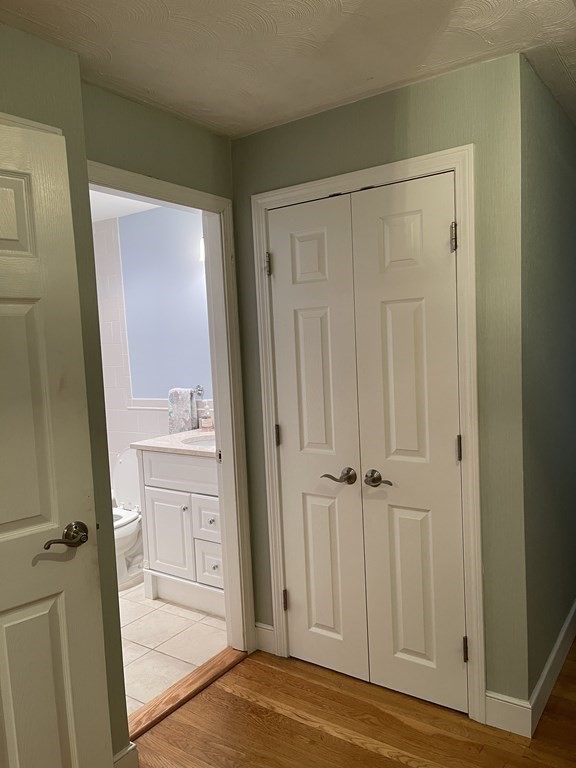 223 Governors Road Quincy, MA 02169 - Photo 29 of 40 a view of bathroom with a sink and mirror