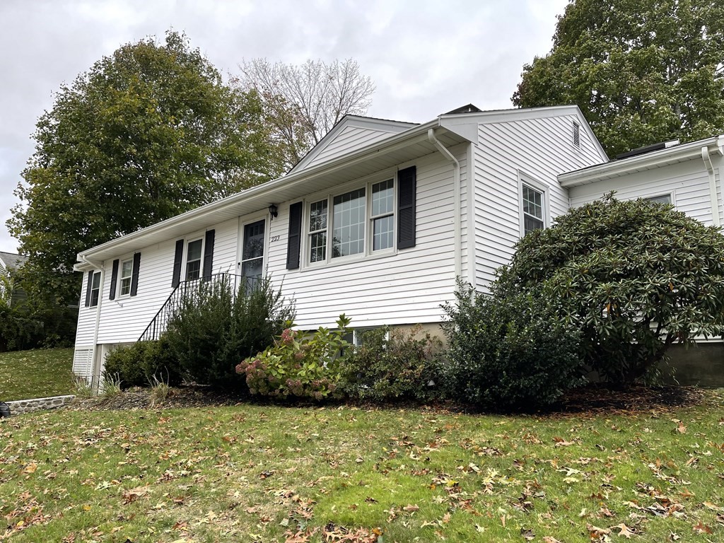 223 Governors Road Quincy, MA 02169 - Photo 3 of 40 a front view of a house with garden