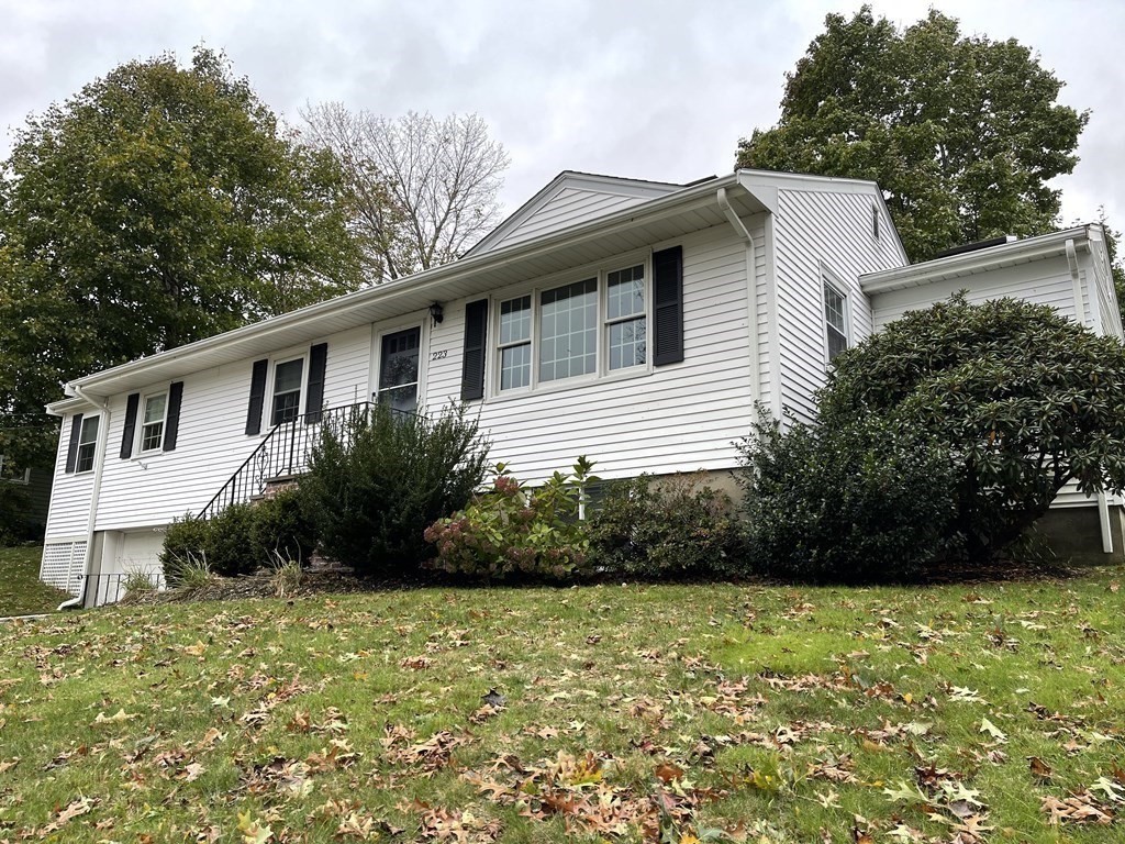 223 Governors Road Quincy, MA 02169 - Photo 36 of 40 a front view of a house with garden