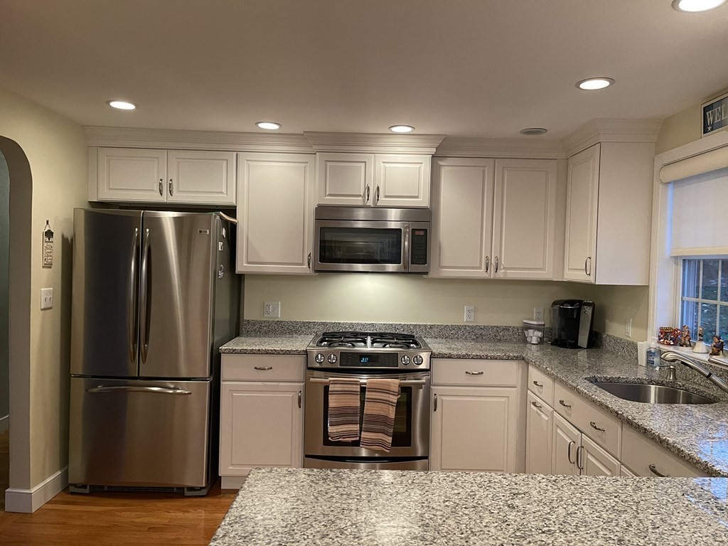 223 Governors Road Quincy, MA 02169 - Photo 8 of 40 a kitchen with a refrigerator sink and microwave