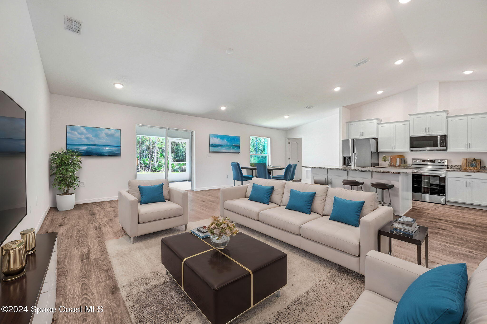 2939 Tishman Road Southeast Palm Bay, FL 32909 - Photo 7 of 34 Virtually Staged Family Room and Dining