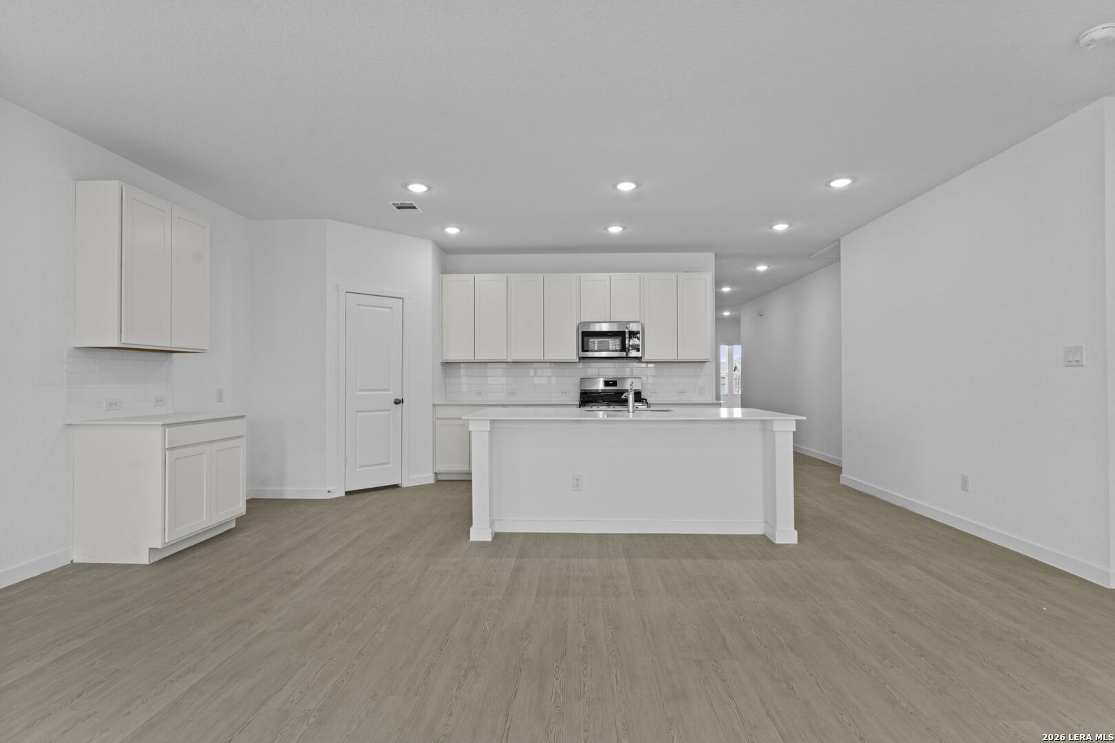 2319 Fort Davis Pass Marion, TX 78124 - Photo 17 of 24 a view of kitchen with kitchen island white cabinets and refrigerator