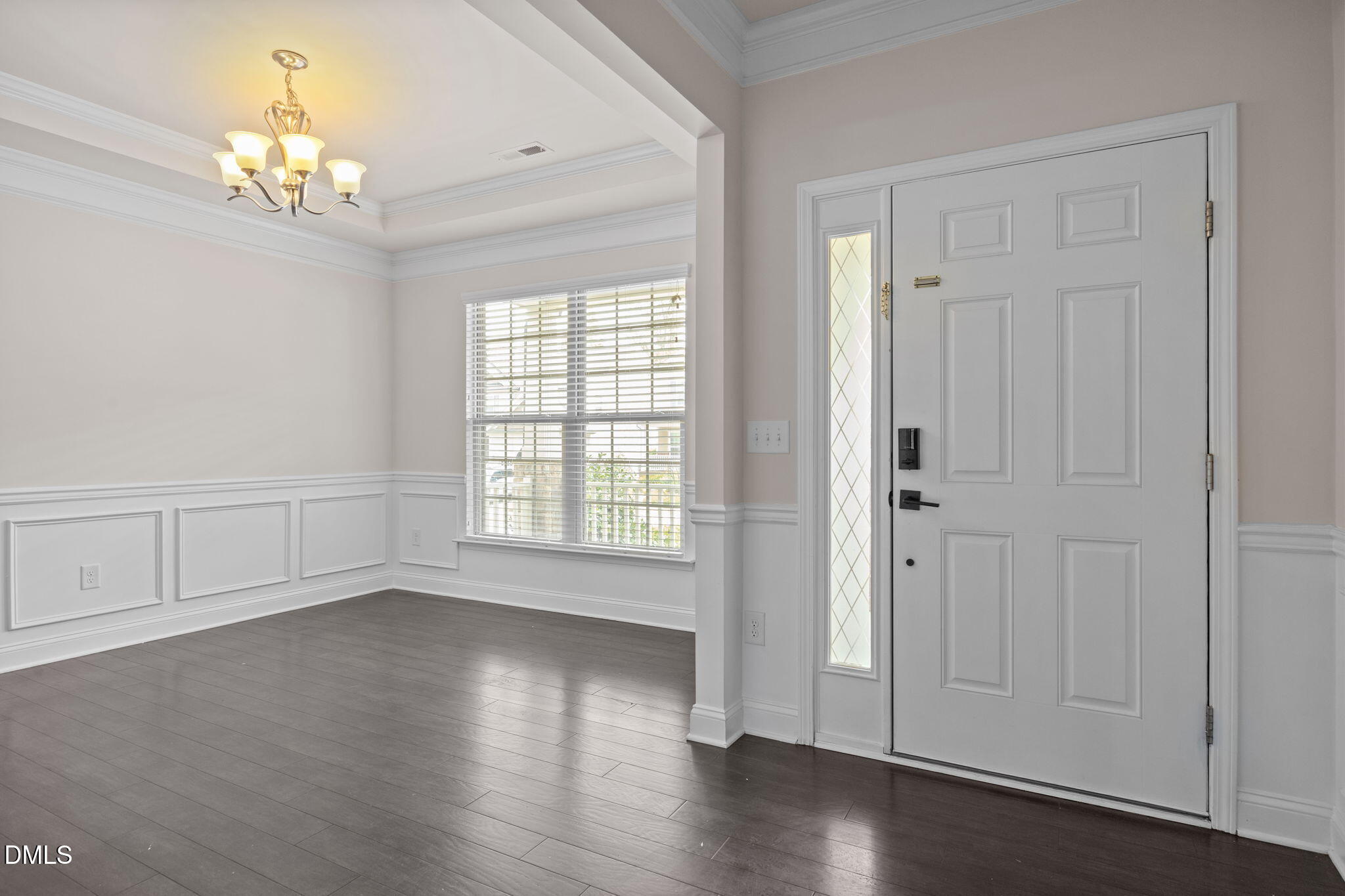 2048 Crampton Grove Way Cary, NC 27519 - Photo 19 of 50 a view of an empty room with wooden floor and a window