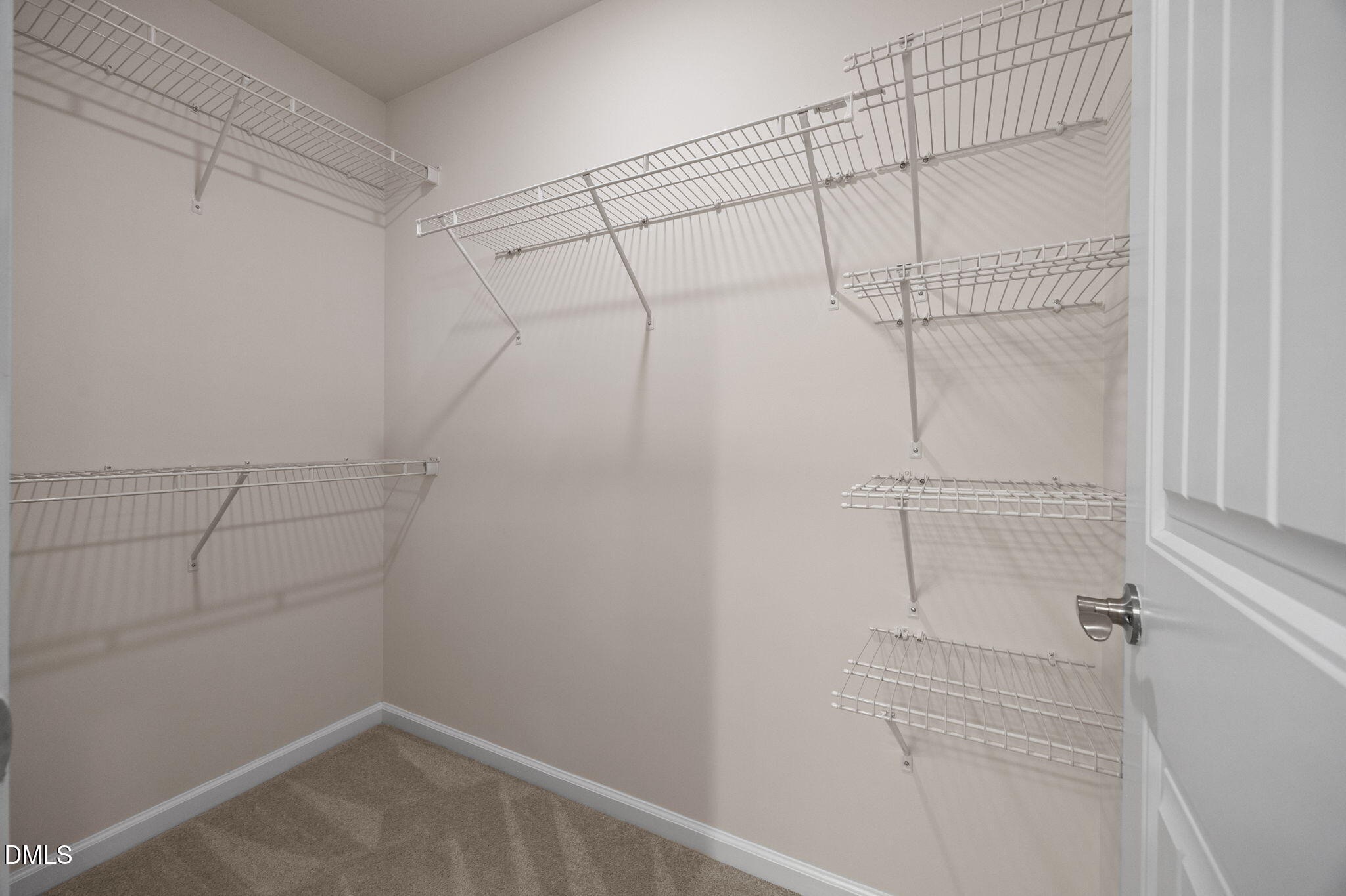 2048 Crampton Grove Way Cary, NC 27519 - Photo 22 of 50 a view of a room with racks on the wall
