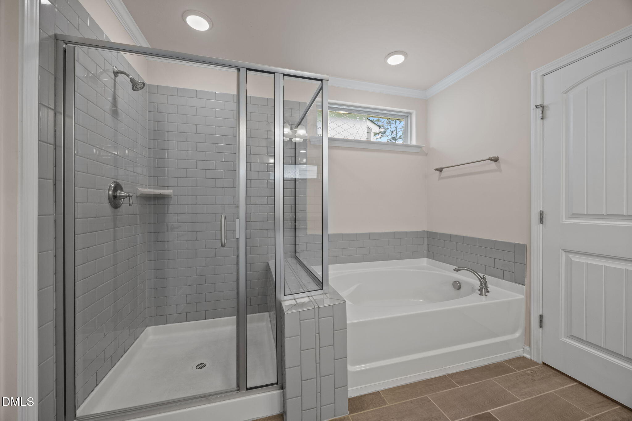 2048 Crampton Grove Way Cary, NC 27519 - Photo 24 of 50 a bathroom with a bathtub and a shower