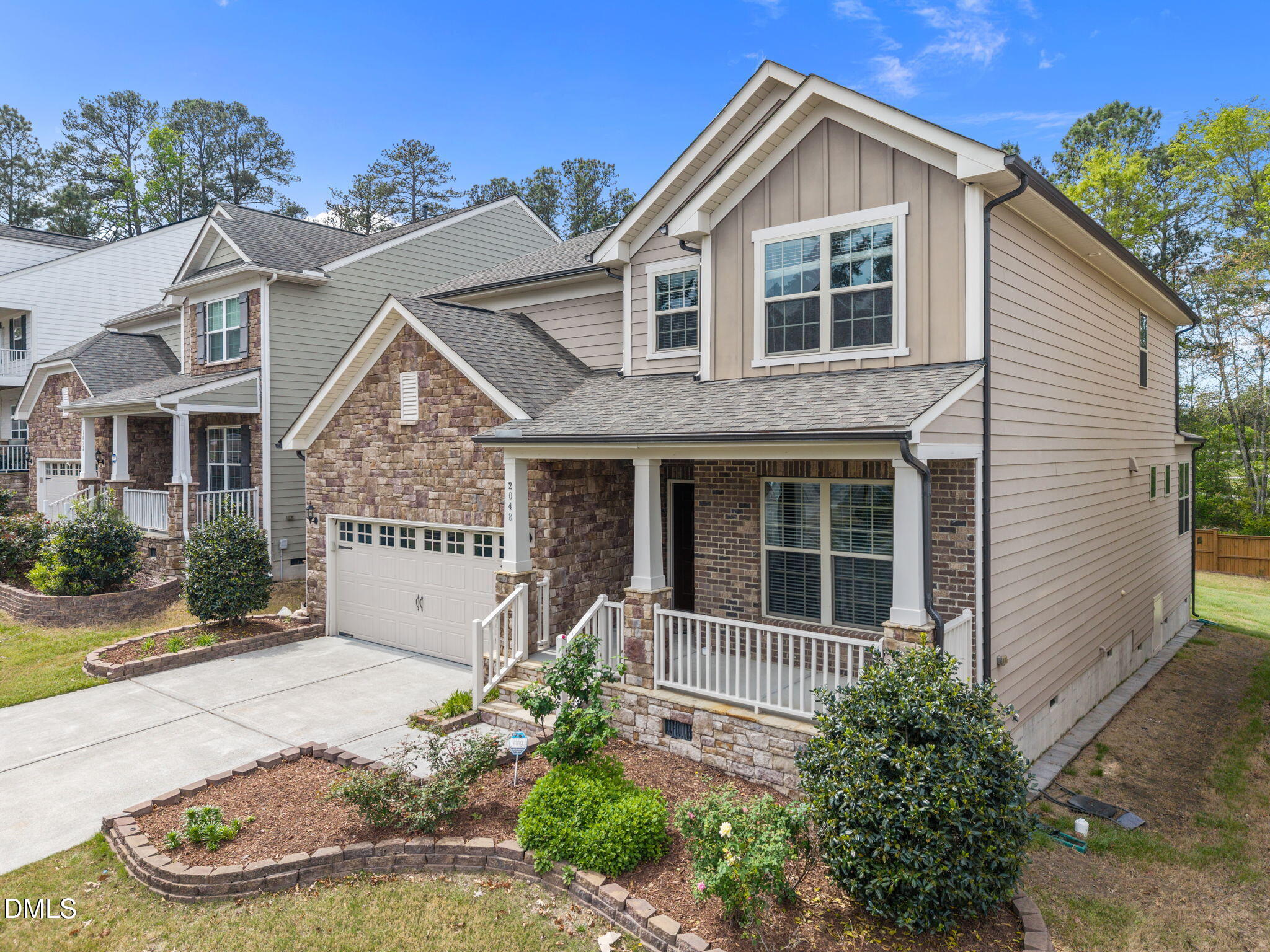 2048 Crampton Grove Way Cary, NC 27519 - Photo 2 of 50 a front view of a house with a yard