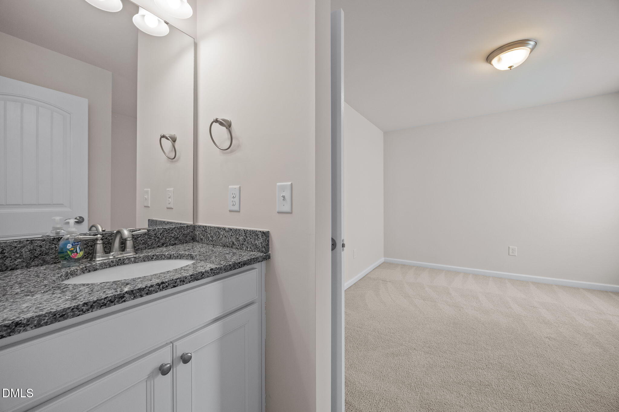 2048 Crampton Grove Way Cary, NC 27519 - Photo 31 of 50 a bathroom with a granite countertop sink and a mirror