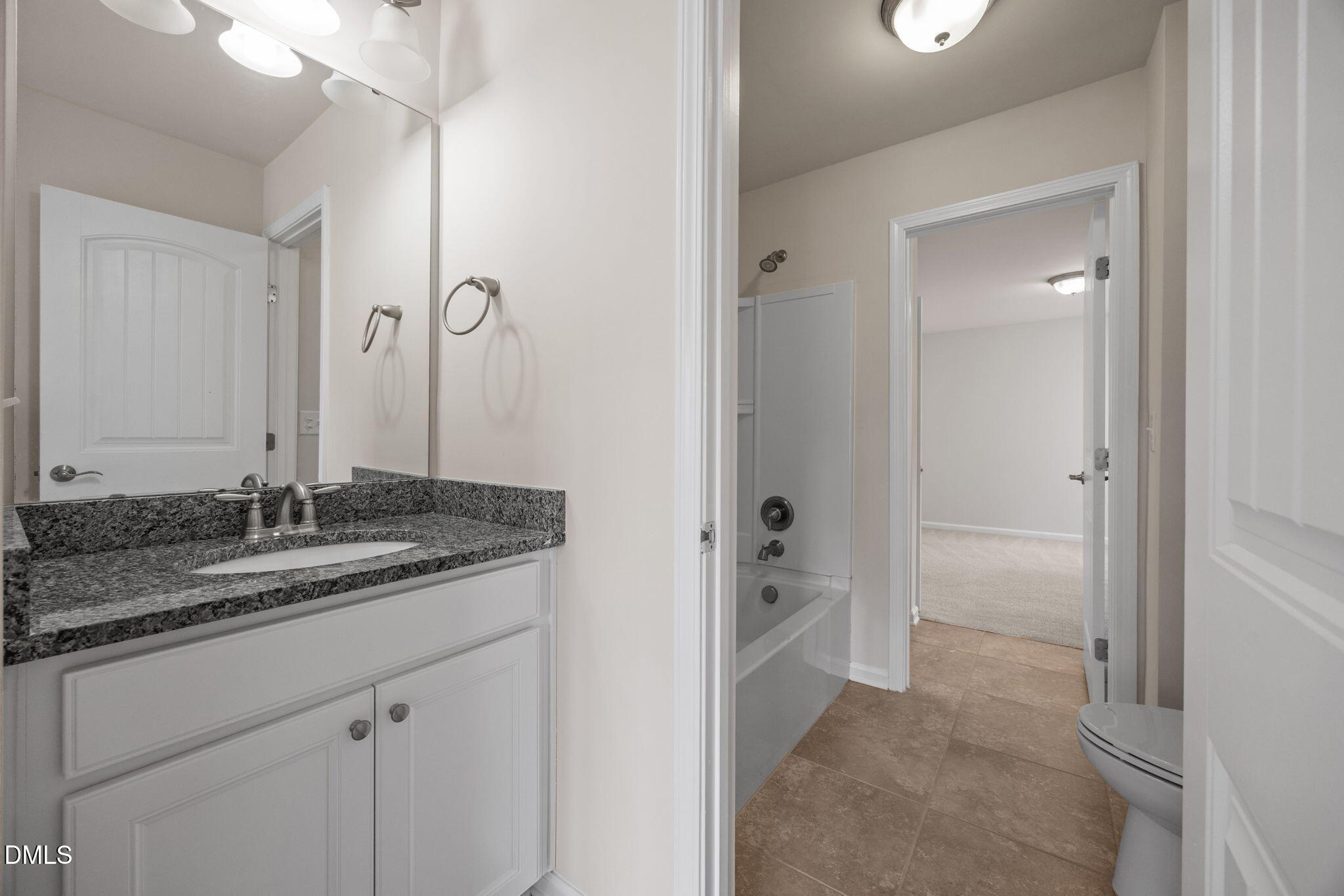 2048 Crampton Grove Way Cary, NC 27519 - Photo 33 of 50 a bathroom with a granite countertop sink and a mirror