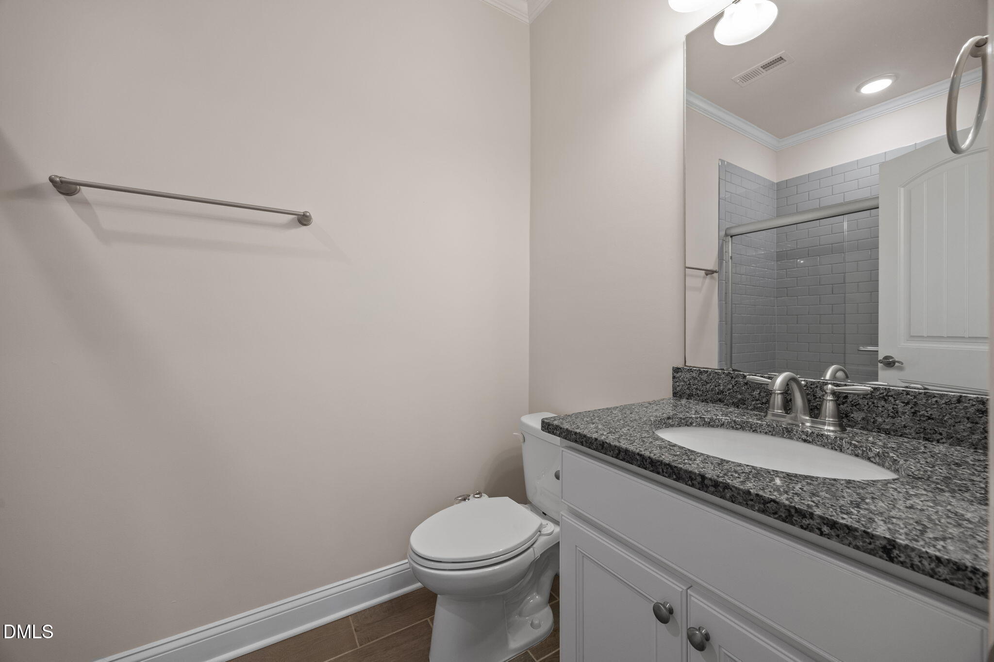 2048 Crampton Grove Way Cary, NC 27519 - Photo 45 of 50 a bathroom with a granite countertop sink toilet and a mirror