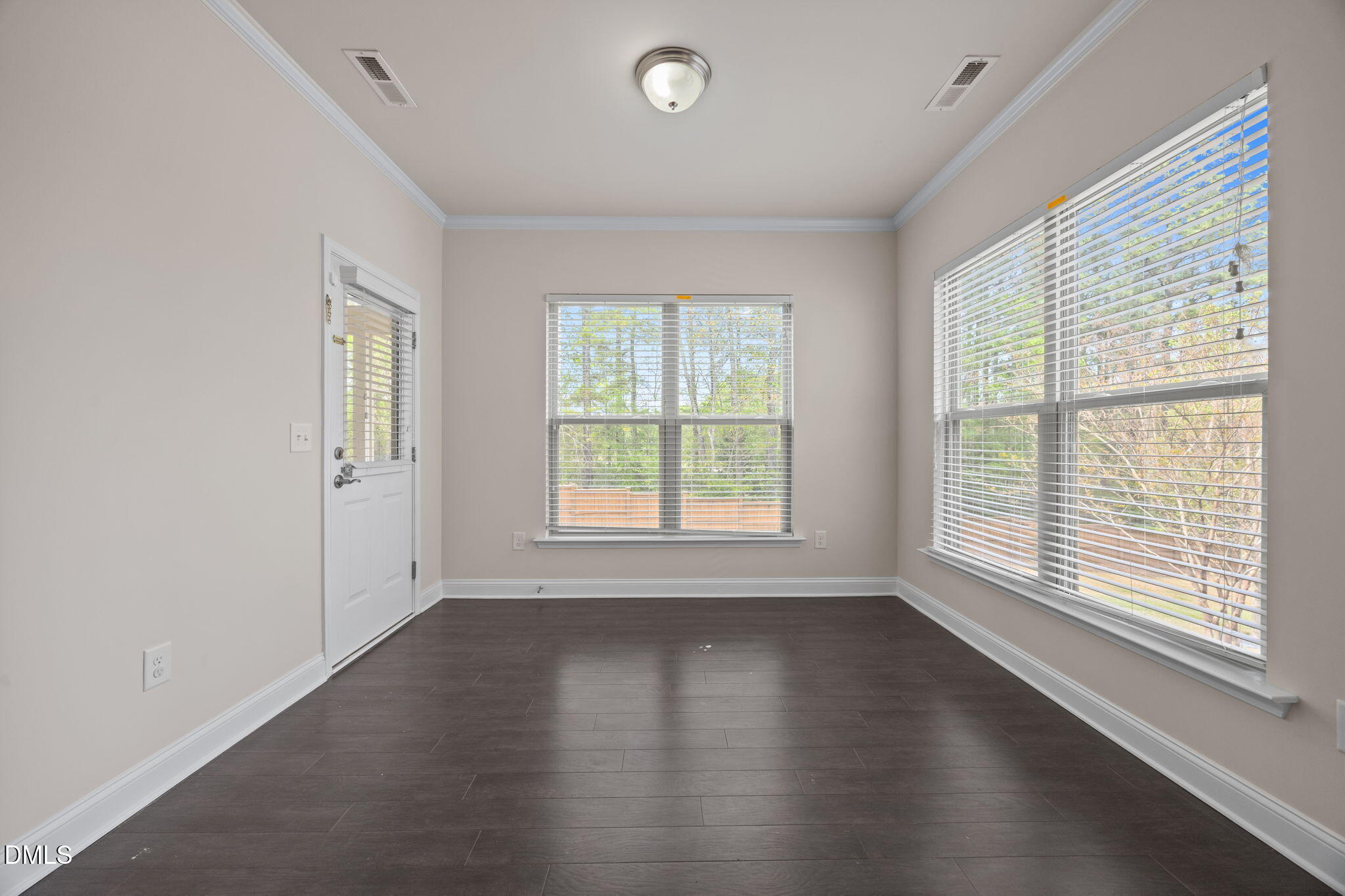 2048 Crampton Grove Way Cary, NC 27519 - Photo 46 of 50 a view of an empty room with wooden floor and a window