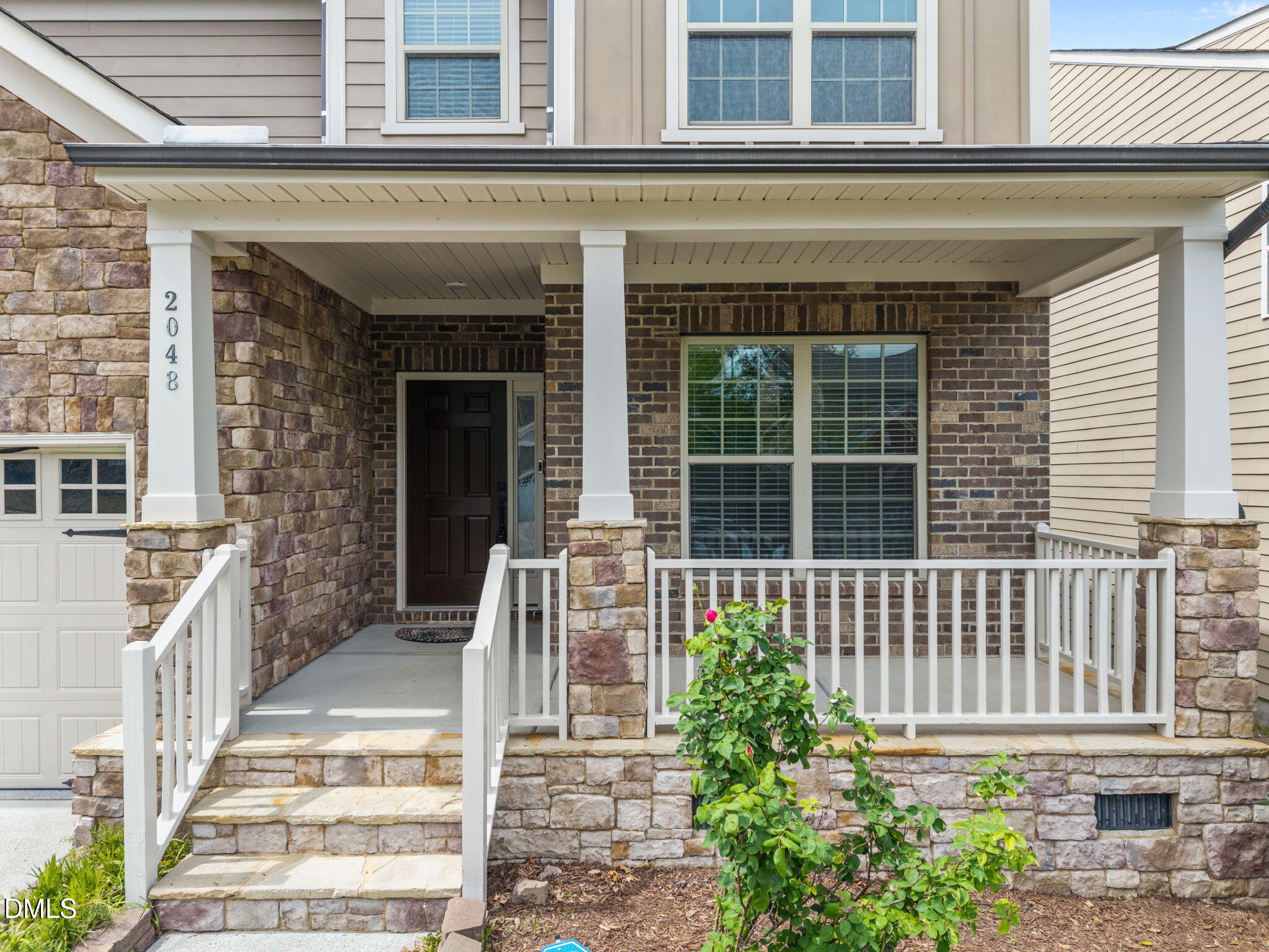 2048 Crampton Grove Way Cary, NC 27519 - Photo 3 of 50 front view of a house with a large window
