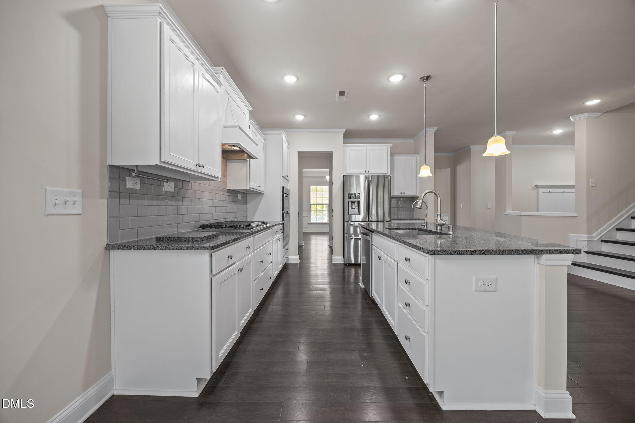 2048 Crampton Grove Way Cary, NC 27519 - Photo 7 of 50 a large kitchen with granite countertop a large counter top a sink stainless steel appliances and cabinets