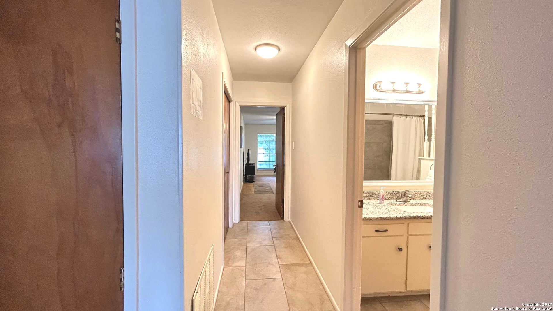 6216 Rue Marielyne Street Leon Valley, TX 78238 - Photo 21 of 35 a view of a bathroom from a hallway