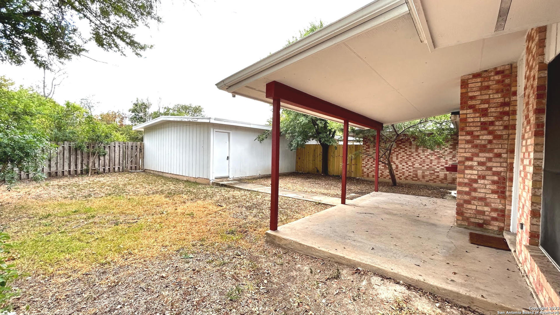 6216 Rue Marielyne Street Leon Valley, TX 78238 - Photo 33 of 35 a backyard of a house with a shaded area