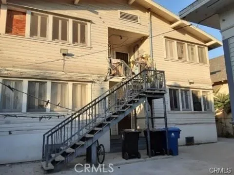 a view of a house with wooden fence