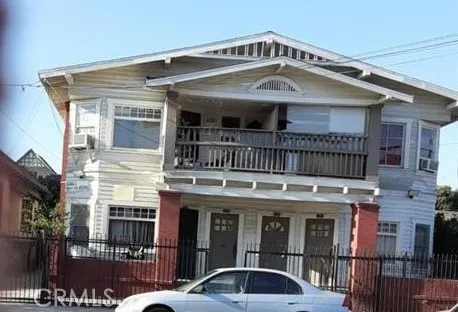 a front view of a house with parking space