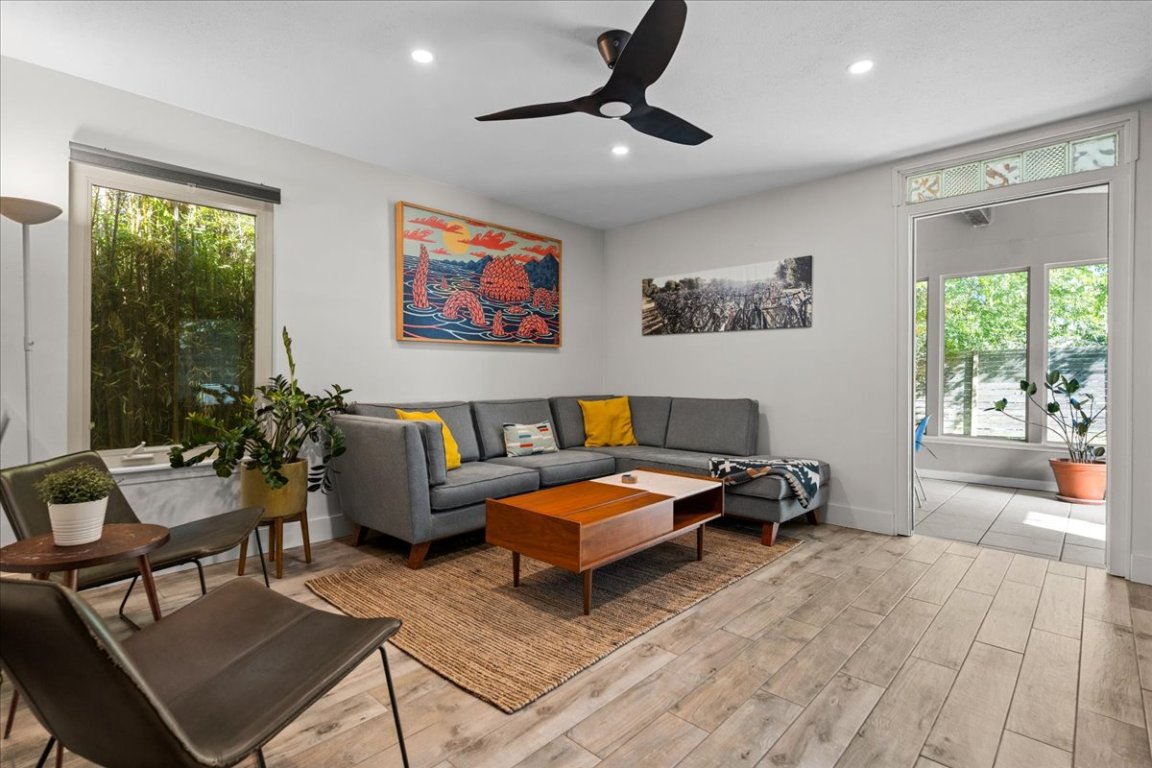 a living room with furniture and a large window