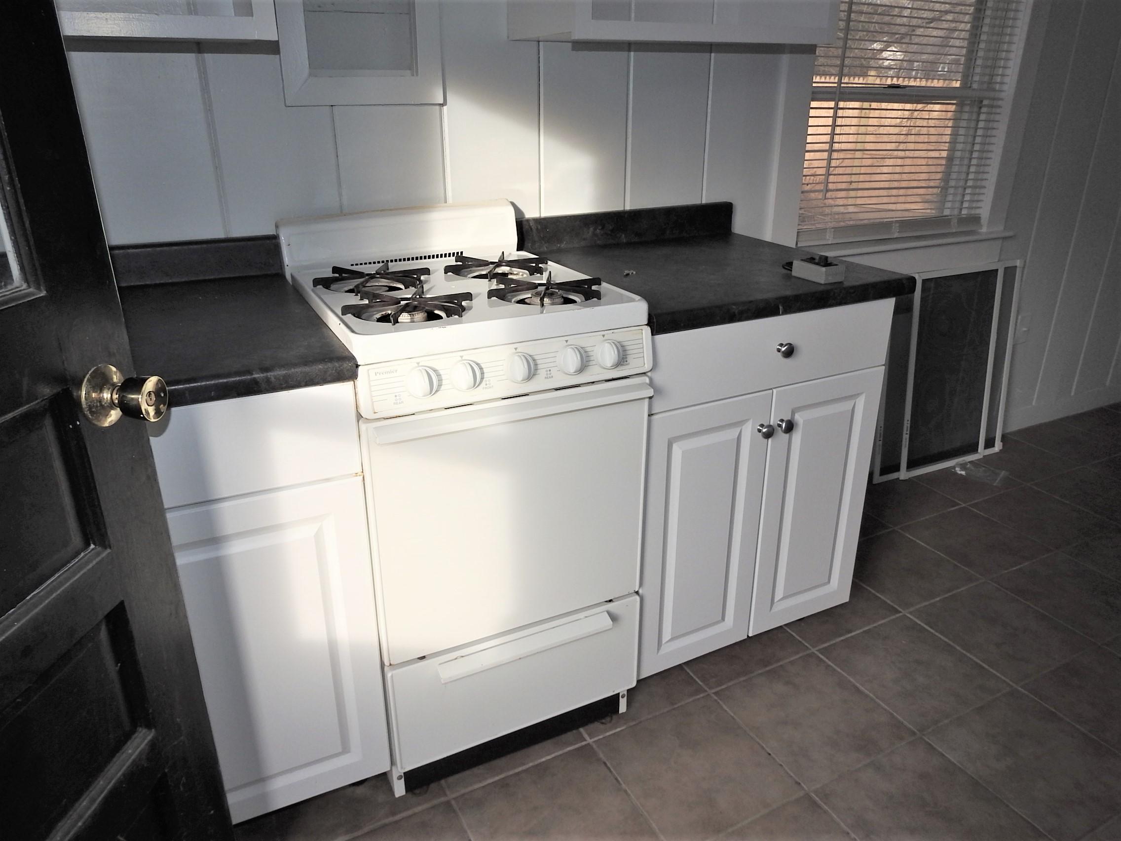 44 Tevyaw Road, Unit 2 Hyannis, MA 02601 - Photo 11 of 40 a white stove top oven sitting inside of a kitchen