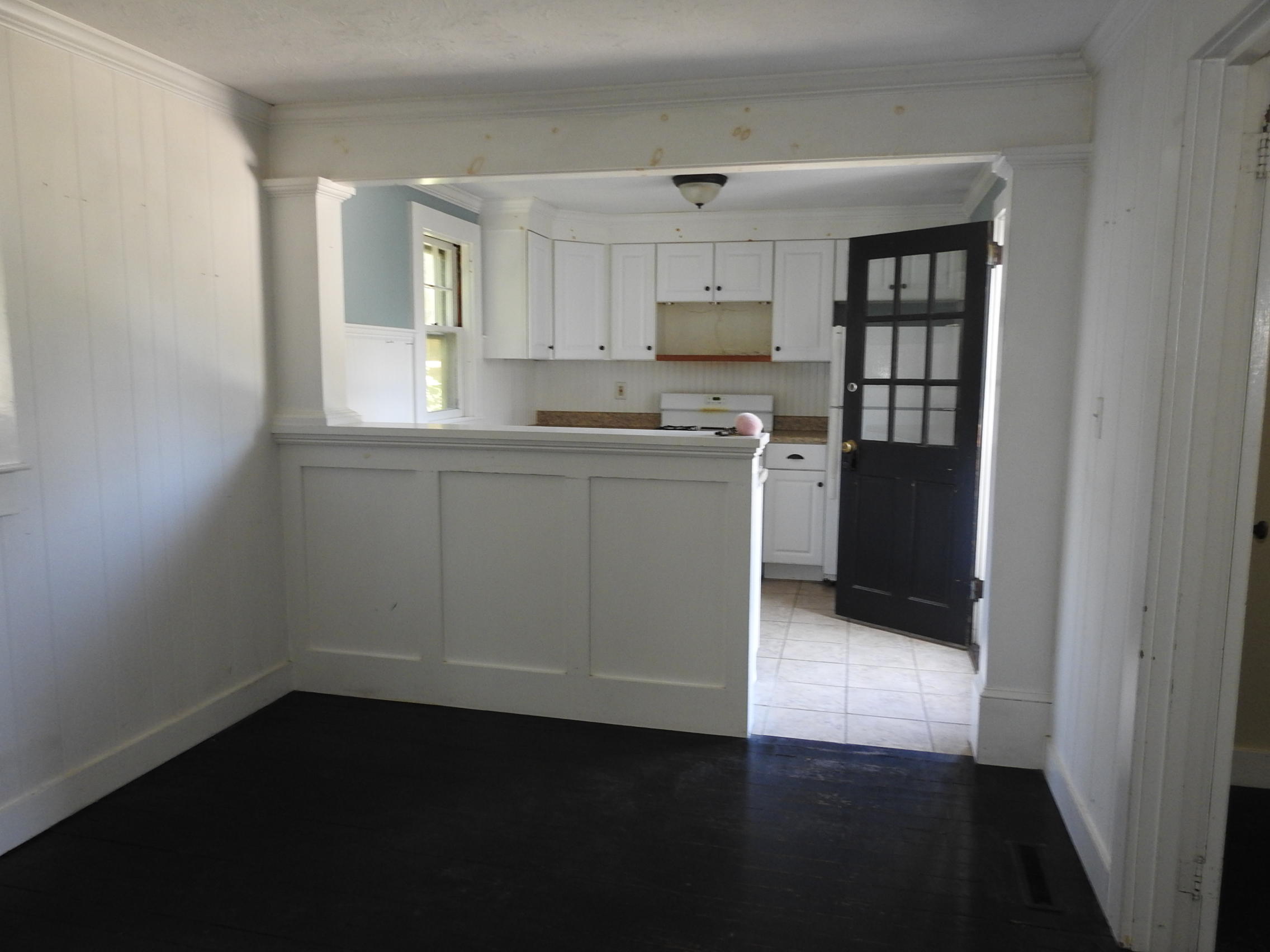 44 Tevyaw Road, Unit 2 Hyannis, MA 02601 - Photo 3 of 40 a kitchen with a refrigerator and white cabinets