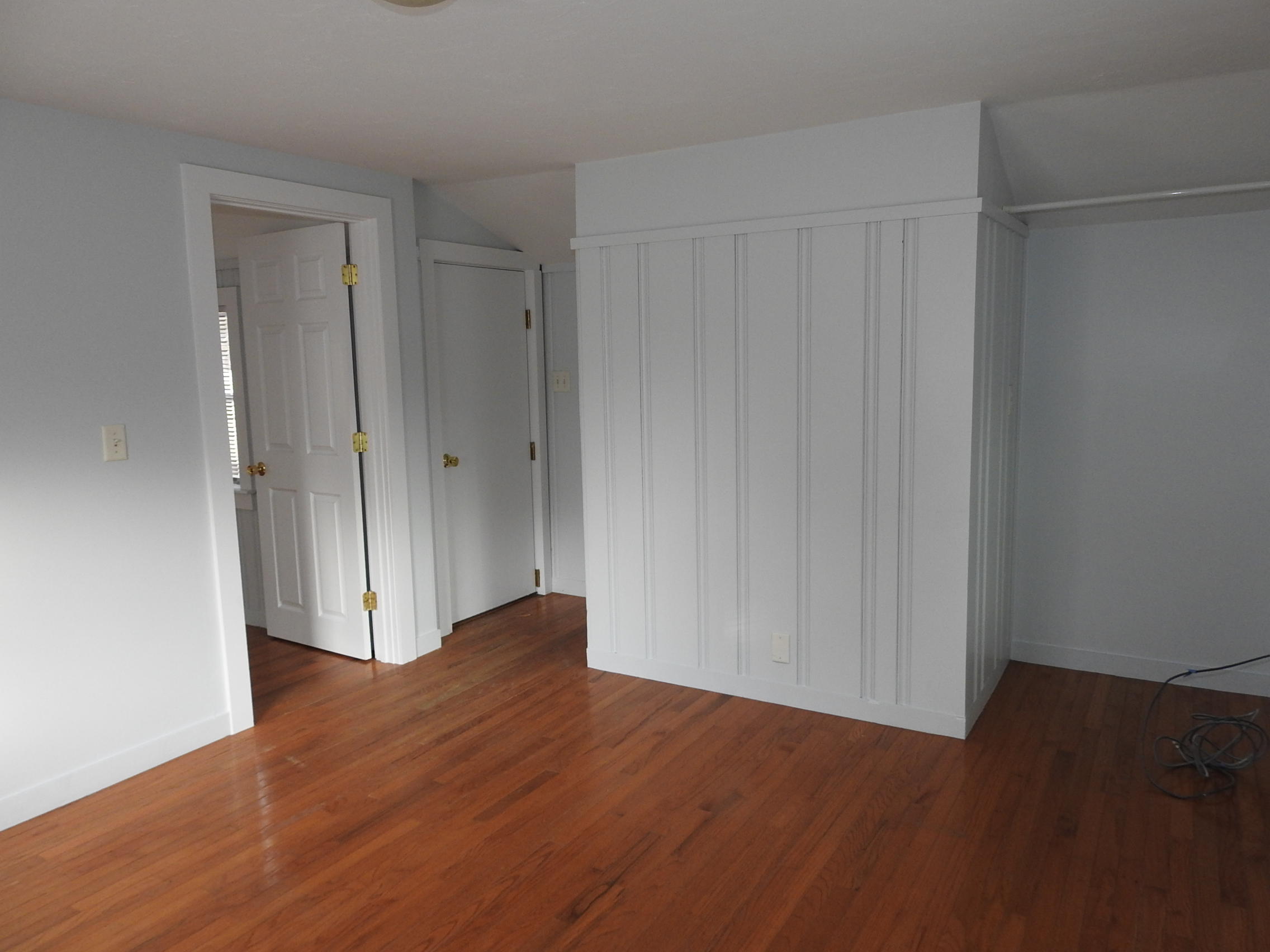 44 Tevyaw Road, Unit 2 Hyannis, MA 02601 - Photo 40 of 40 a view of an empty room with wooden floor