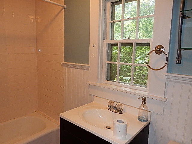44 Tevyaw Road, Unit 2 Hyannis, MA 02601 - Photo 4 of 40 a bathroom with a sink and a window