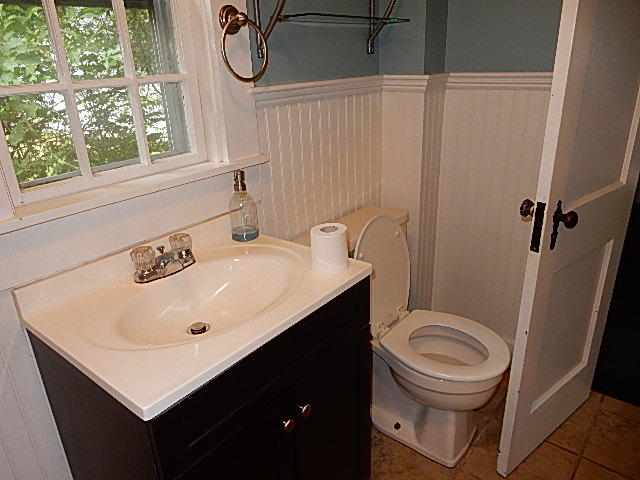 44 Tevyaw Road, Unit 2 Hyannis, MA 02601 - Photo 6 of 40 a bathroom with a sink a toilet and a mirror
