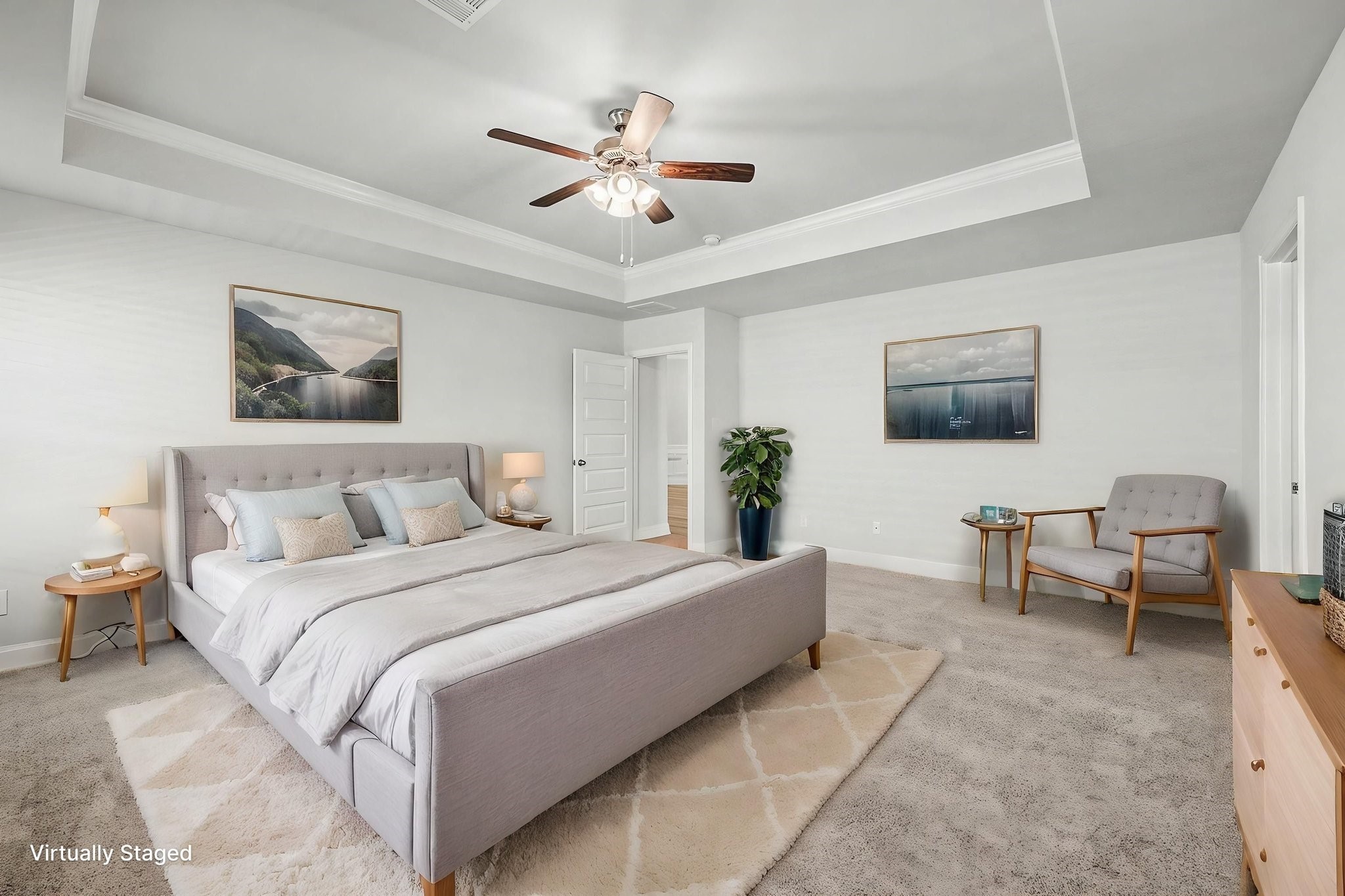 601 Greystone Lane Angleton, TX 77515 - Photo 19 of 32 a spacious bedroom with a bed and a chandelier
