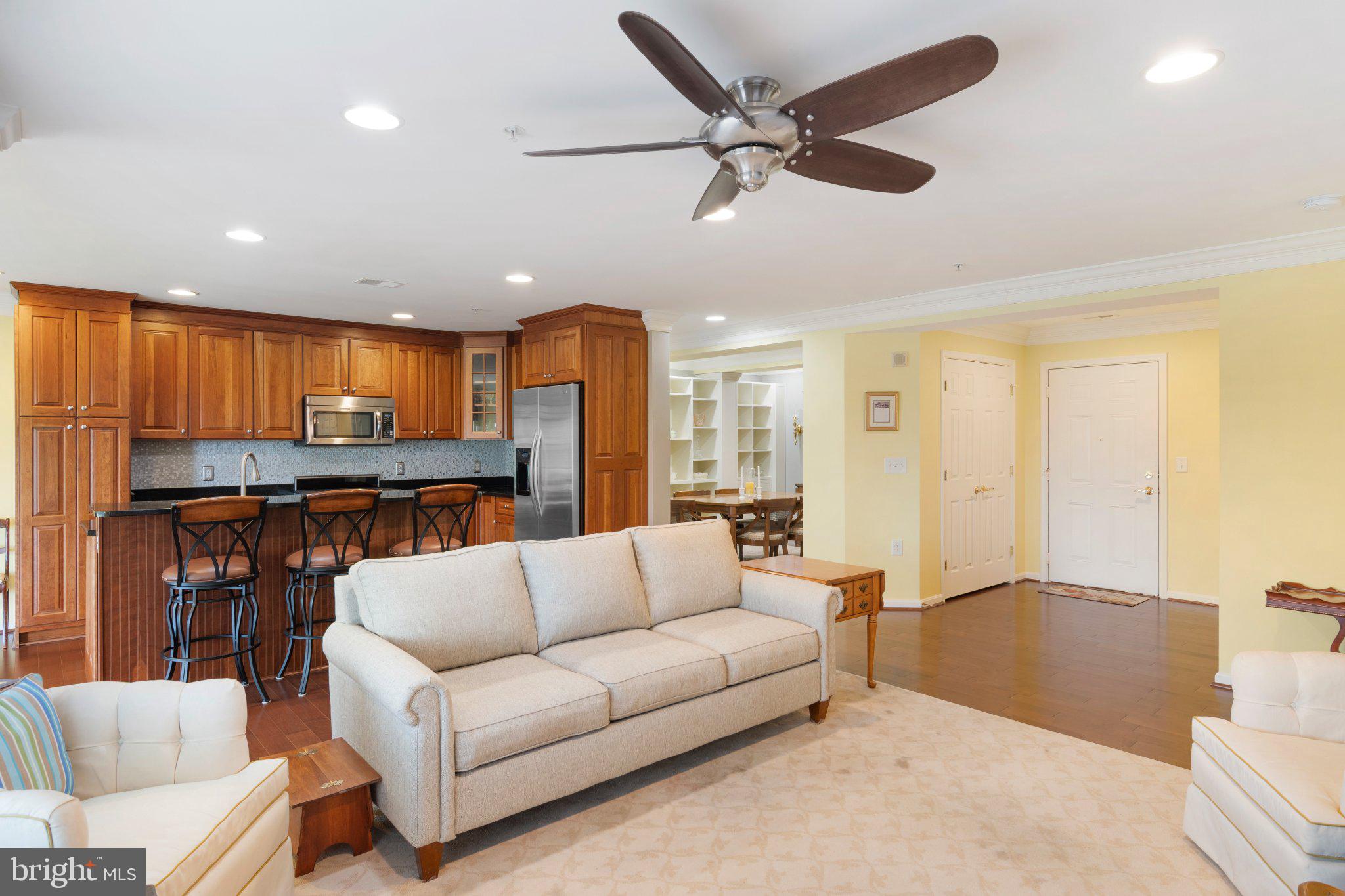 12236 Roundwood Road, Unit 609 Lutherville-Timonium, MD 21093 - Photo 11 of 40 a living room with furniture and kitchen view