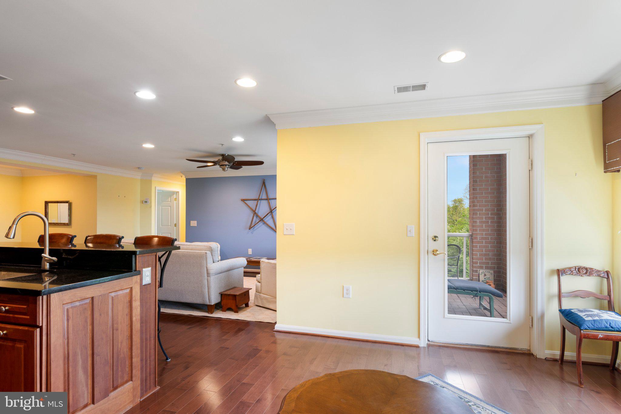12236 Roundwood Road, Unit 609 Lutherville-Timonium, MD 21093 - Photo 15 of 40 a view of a livingroom with furniture and wooden floor