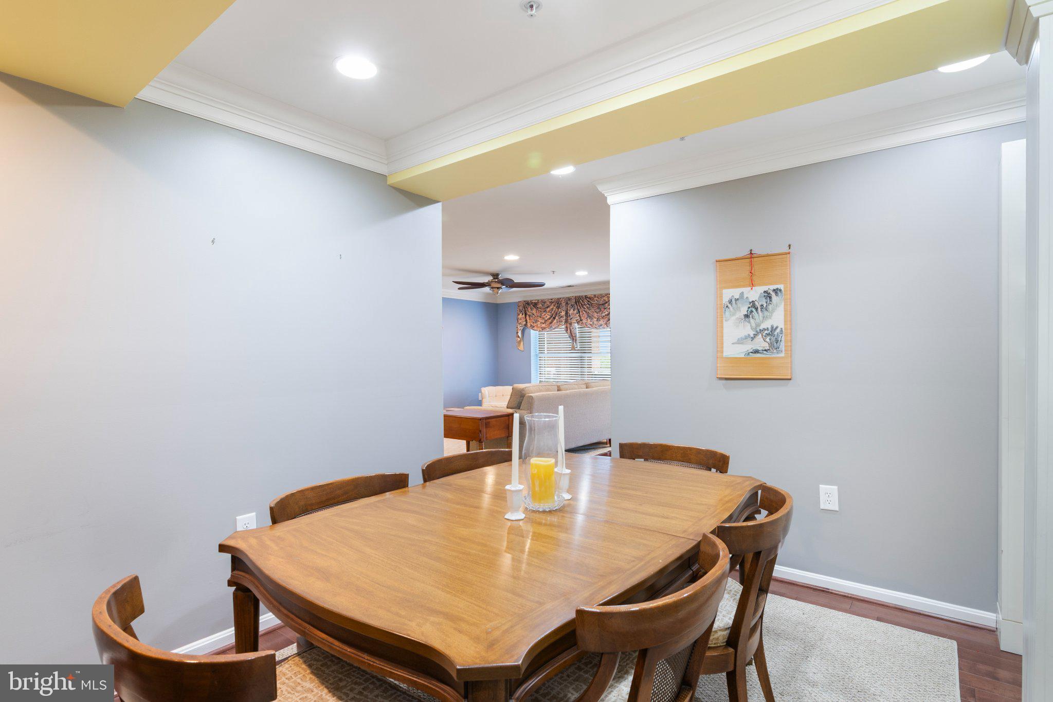 12236 Roundwood Road, Unit 609 Lutherville-Timonium, MD 21093 - Photo 17 of 40 a dining room with furniture and a window