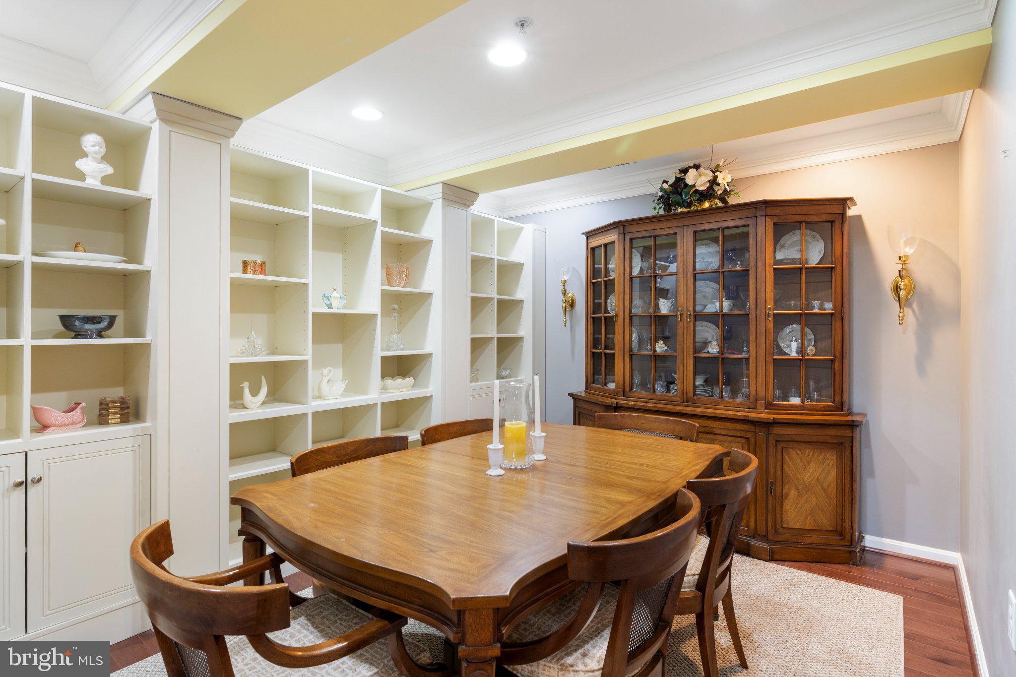 12236 Roundwood Road, Unit 609 Lutherville-Timonium, MD 21093 - Photo 18 of 40 a view of a dining room with furniture and wooden floor