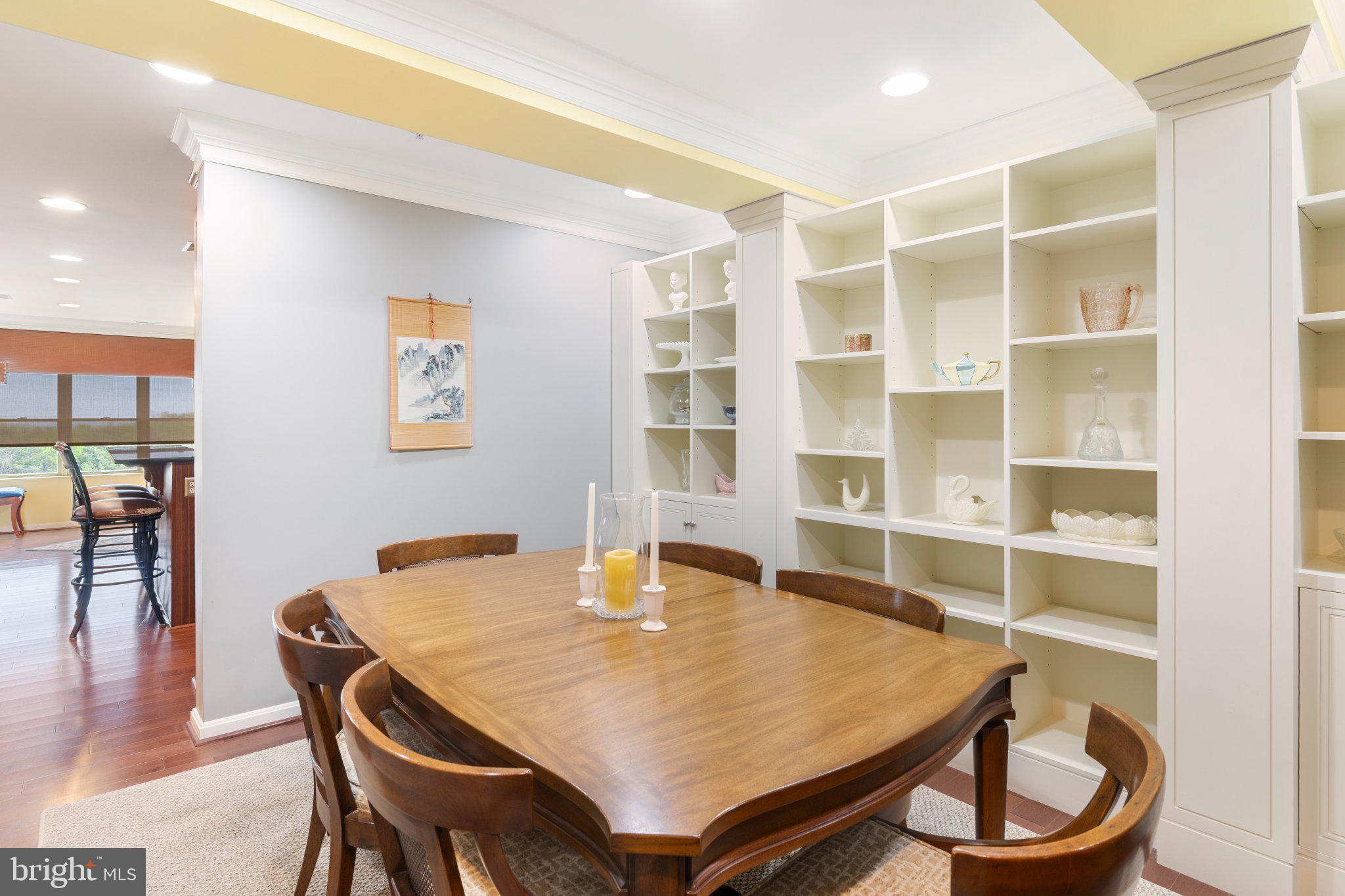 12236 Roundwood Road, Unit 609 Lutherville-Timonium, MD 21093 - Photo 19 of 40 a dining room with a table and chairs in it
