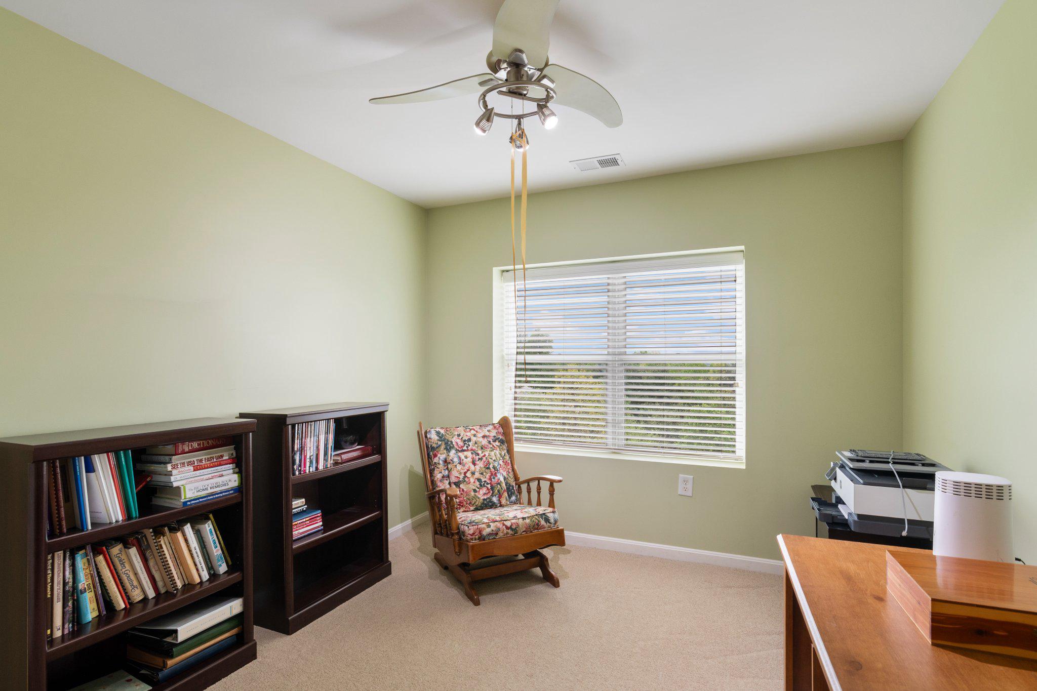 12236 Roundwood Road, Unit 609 Lutherville-Timonium, MD 21093 - Photo 20 of 40 a bedroom with furniture and a book shelf
