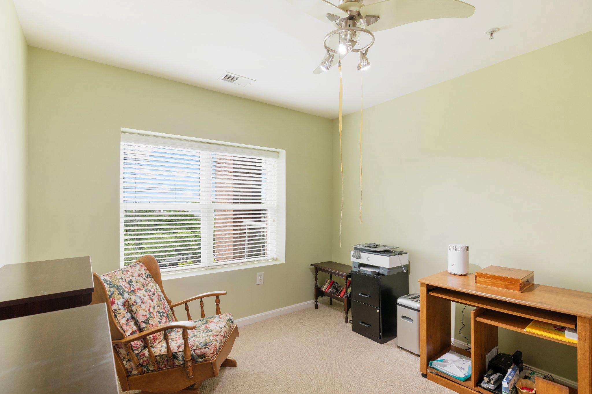12236 Roundwood Road, Unit 609 Lutherville-Timonium, MD 21093 - Photo 21 of 40 a living room with furniture and a window
