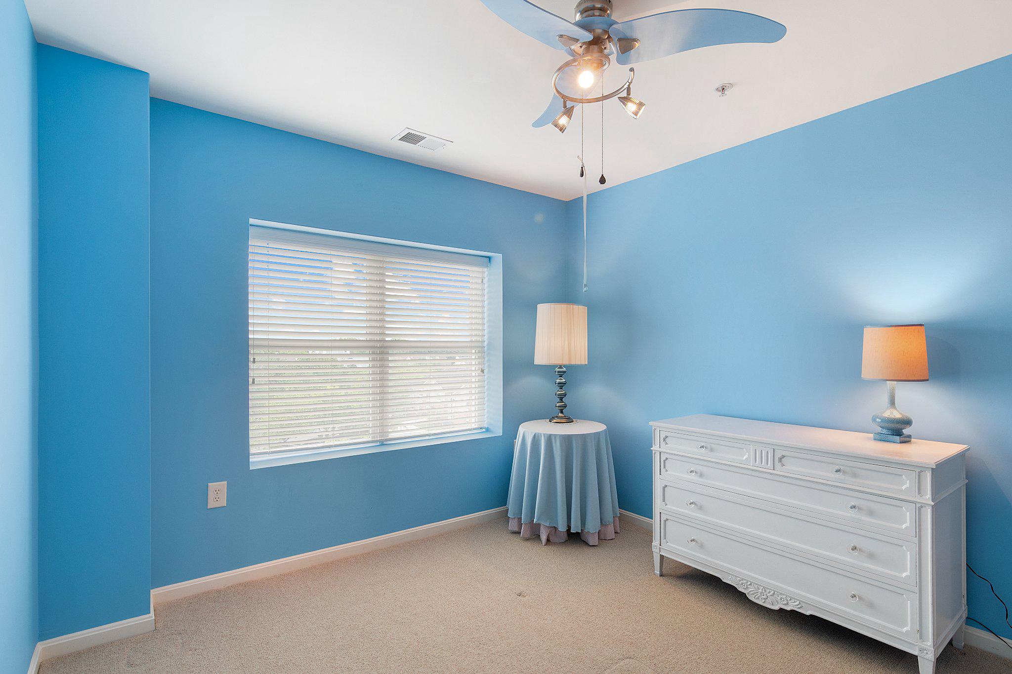 12236 Roundwood Road, Unit 609 Lutherville-Timonium, MD 21093 - Photo 26 of 40 a bedroom with a bed and a window