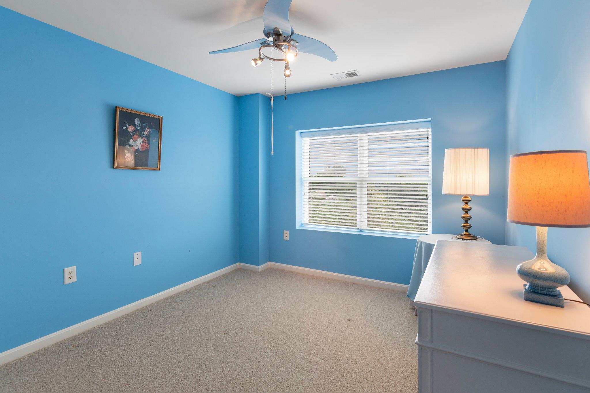 12236 Roundwood Road, Unit 609 Lutherville-Timonium, MD 21093 - Photo 27 of 40 a bedroom with a bed and a window