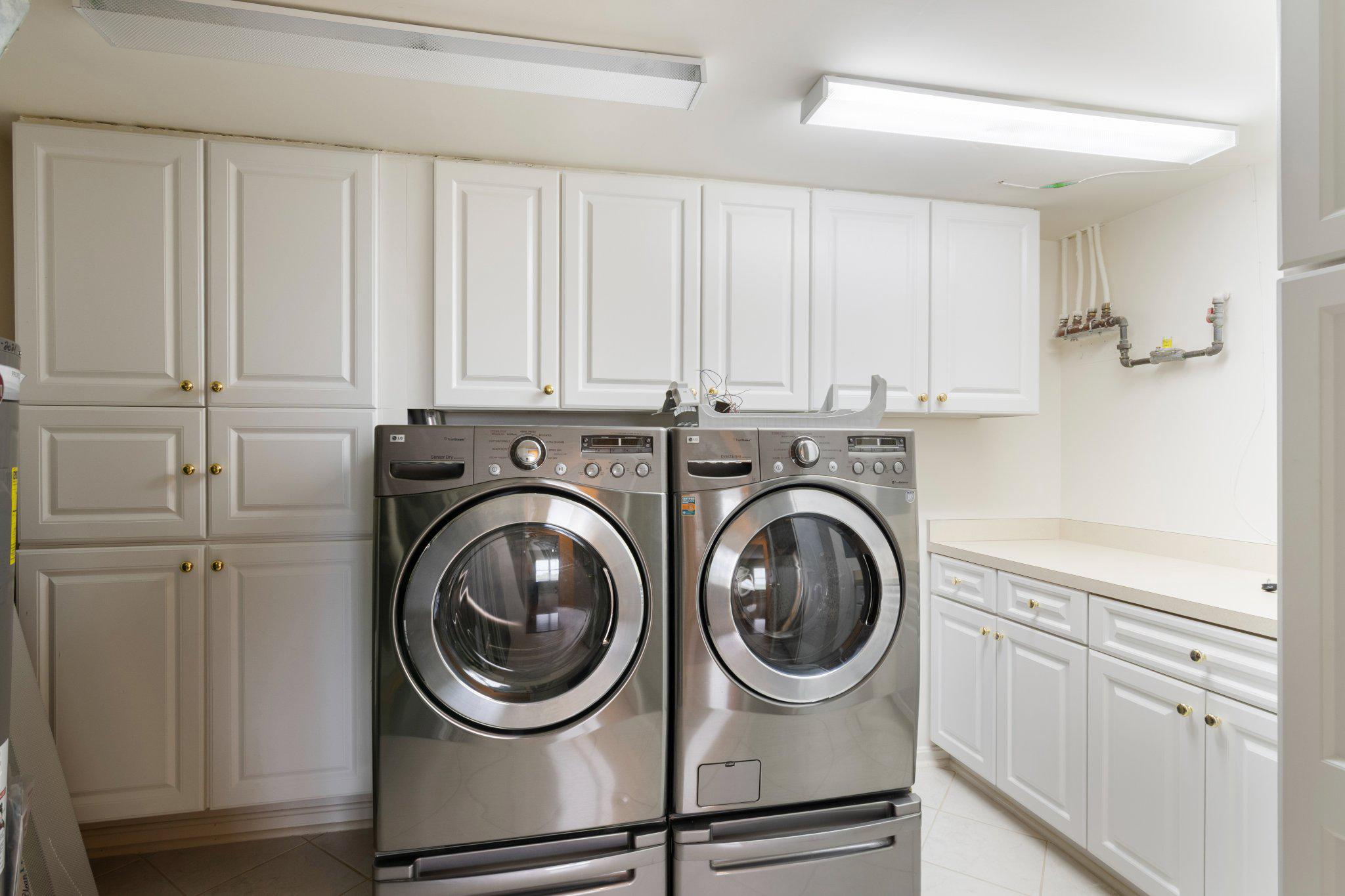 12236 Roundwood Road, Unit 609 Lutherville-Timonium, MD 21093 - Photo 35 of 40 a utility room with sink dryer and washer