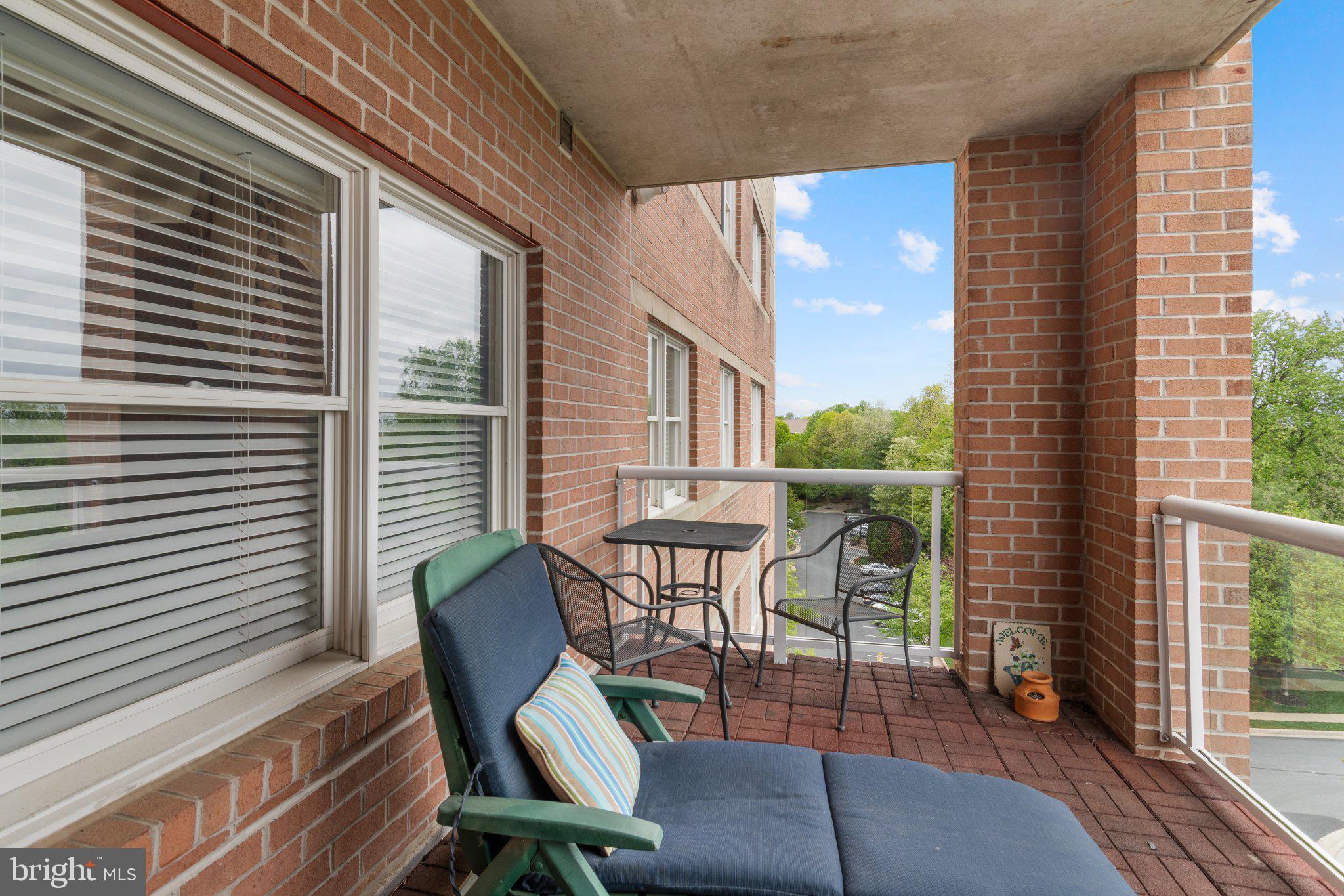 12236 Roundwood Road, Unit 609 Lutherville-Timonium, MD 21093 - Photo 37 of 40 a view of a chair and table in the balcony