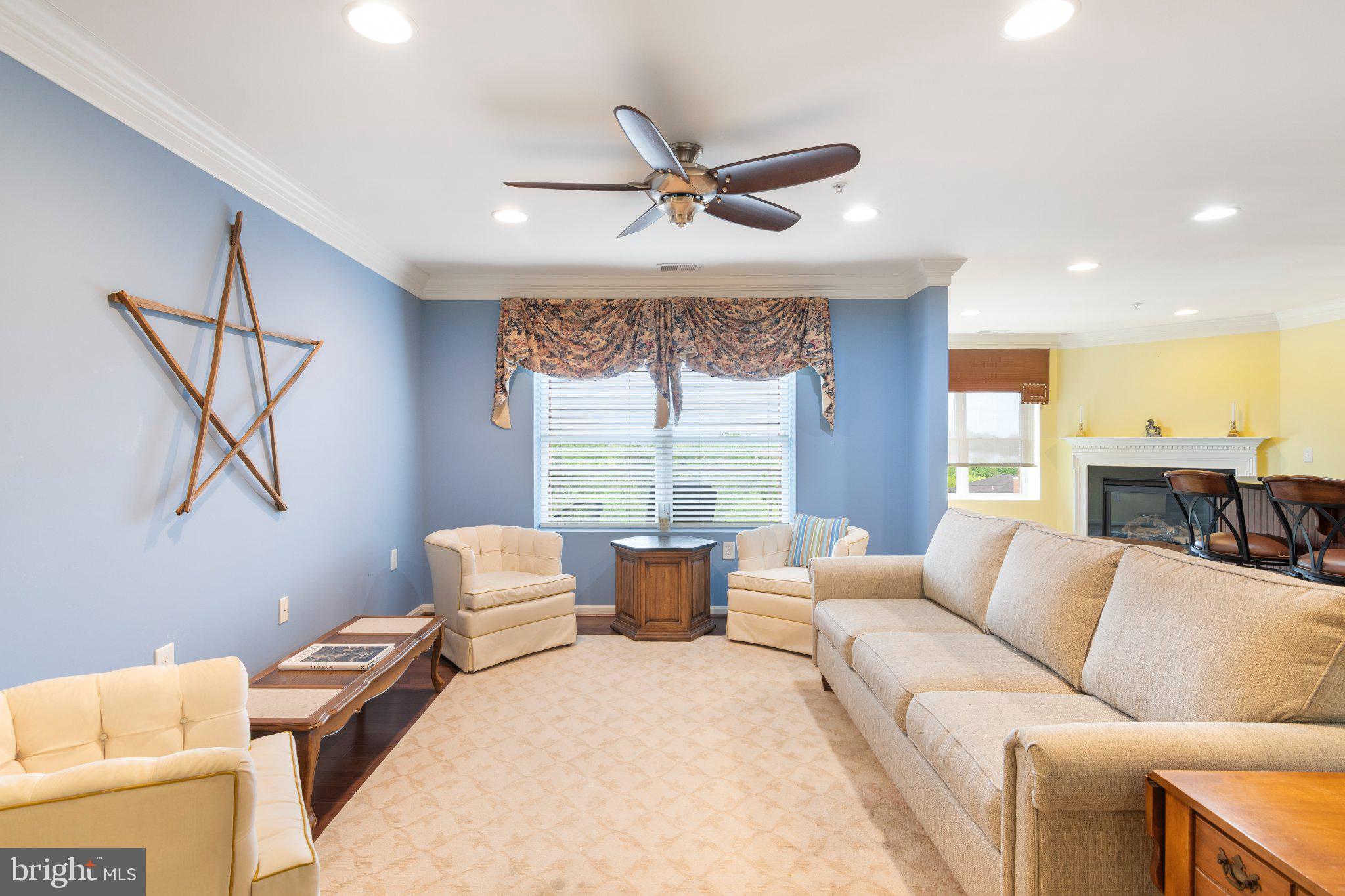 12236 Roundwood Road, Unit 609 Lutherville-Timonium, MD 21093 - Photo 7 of 40 a living room with furniture and a large window